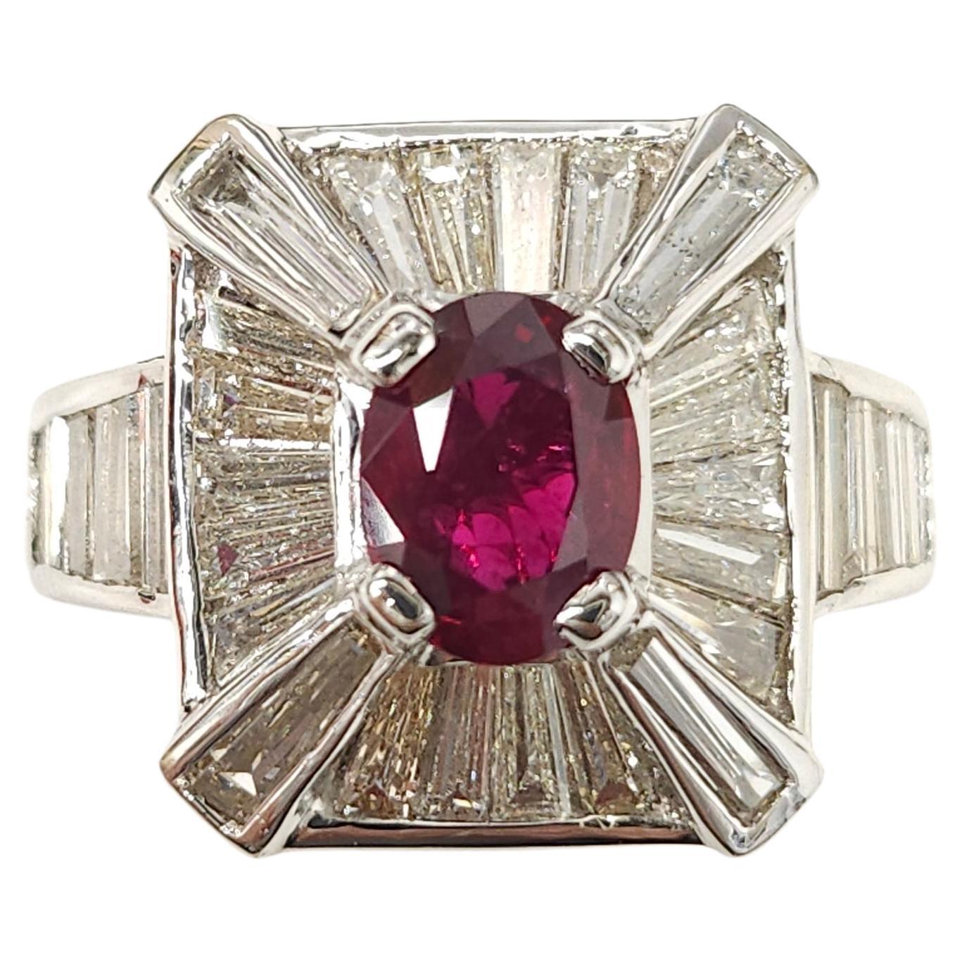Introducing a stunning piece of jewelry, the IGI Certified 1.19 Carat deep red natural ruby in an exquisite oval shape and surrounded by natural diamonds in an Art Deco style ring. Crafted from 18K White Gold, this ring is a true masterpiece.

At