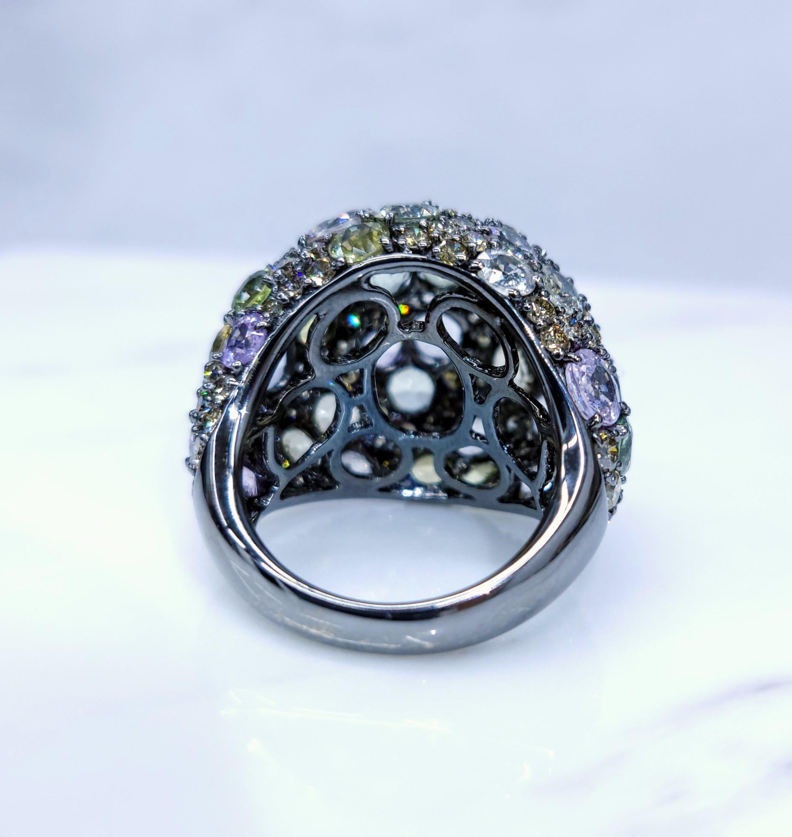 This exquisite ring features a captivating array of 39 mixed-colors sapphires, totaling 12.18 carats. The sapphires showcase a vibrant range of colors, including green, yellow, pink, and colorless, creating a stunning and unique centerpiece. The