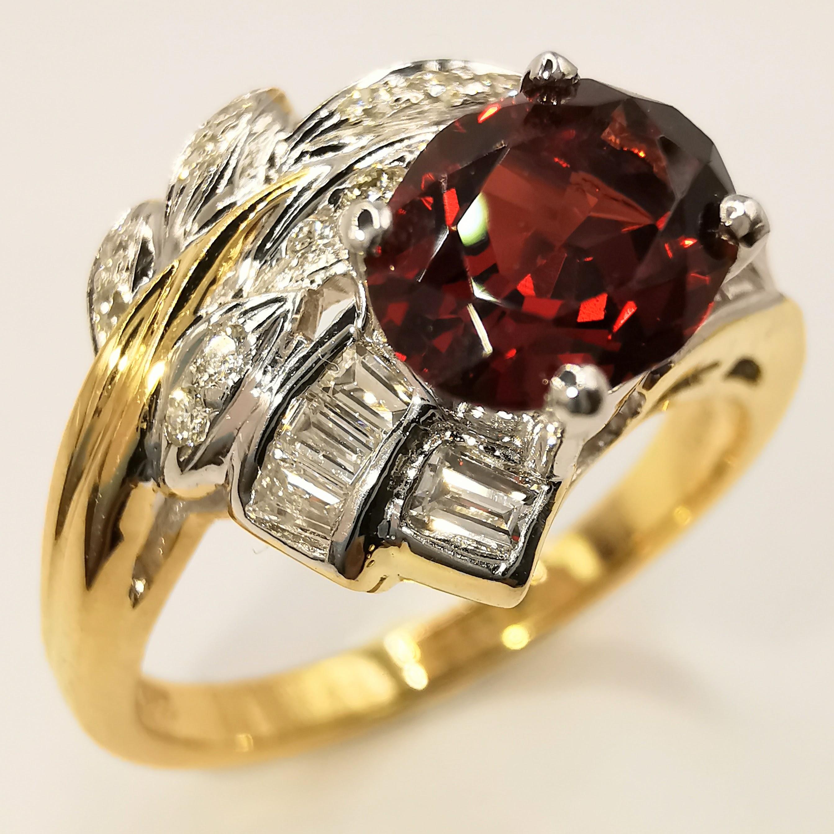 This Vintage IGI Vertified 1.21ct Oval-cut Orangy Red Garnet Diamond 20K Gold Ring is a stunning piece of jewelry that is sure to turn heads. The centerpiece of the ring is a beautiful 1.21 carat natural oval cut deep orangy red pyrope-almandite