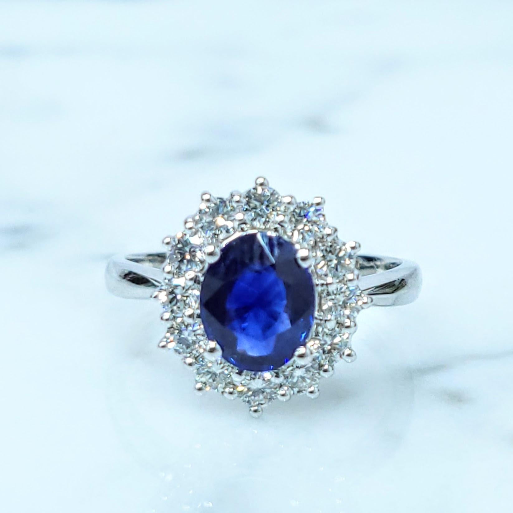 Discover the captivating allure of this exquisite ring, showcasing a magnificent 1.23-carat oval mixed cut sapphire of a truly intense blue hue. This vibrant and captivating color evokes the deep tranquility of ocean waters and the brilliance of a