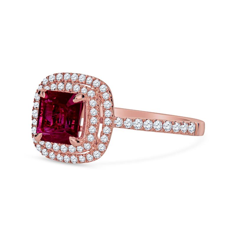 This enchanting ring showcases a 1.24ct emerald-cut natural ruby, elegantly framed by a double halo of 74 round diamonds totaling 0.29 carat. Crafted from luxurious 18 karat rose gold, this cathedral-style piece adds a touch of sophistication and