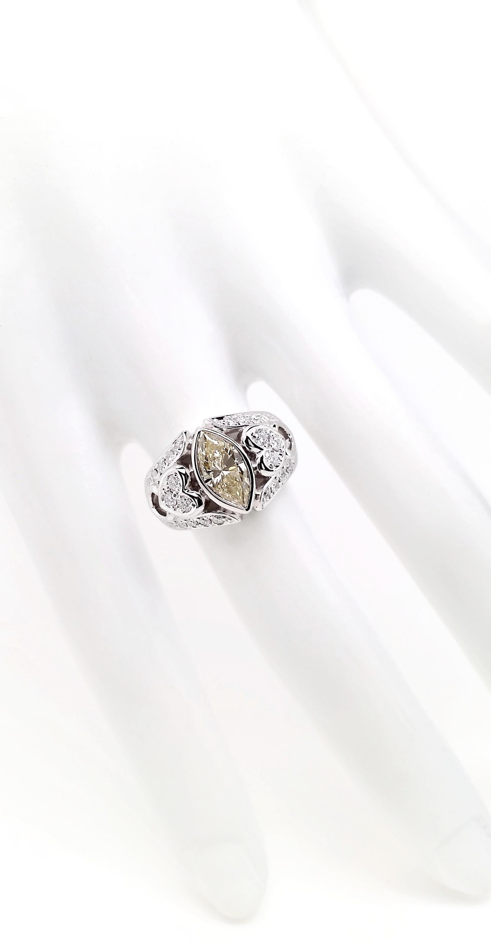 Marquise Cut IGI Certified 1.24ct Natural Fancy Yellow Diamond Platinum Ring For Sale