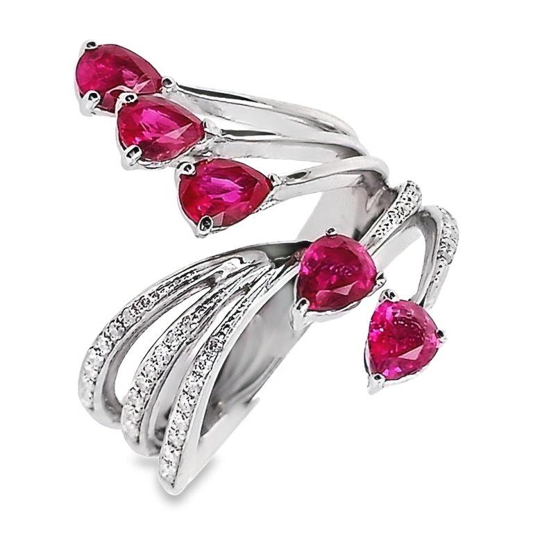 Elevate your style with this timeless piece from Top Crown Jewelry House collection, that combines the warmth of 18K gold, the allure of pear-shaped burma rubies and the brilliance of sparkling diamonds.
This brilliant ring has a stunning