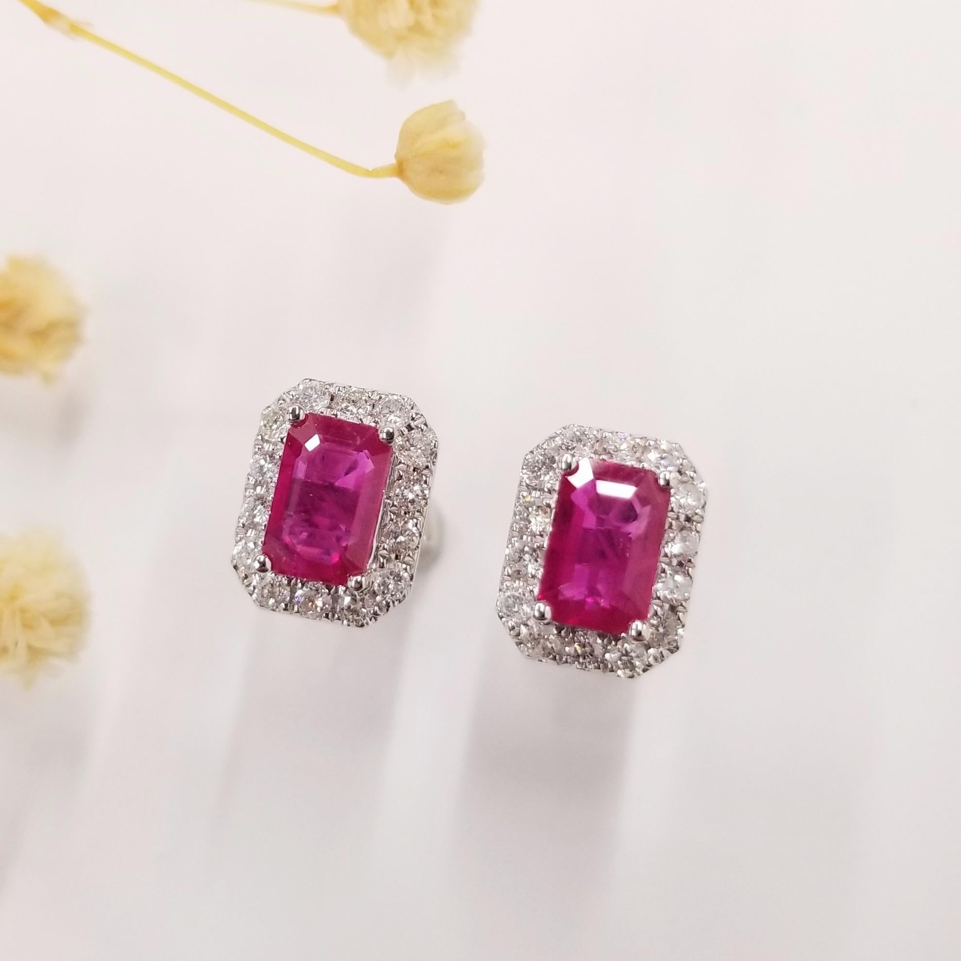 Securing a matched pair of natural rubies in the distinctive emerald shape for earrings can be a tremendous challenge. However, these earrings showcase an extraordinary IGI Certified 1.44 Carat Ruby, renowned for its superb quality and originating
