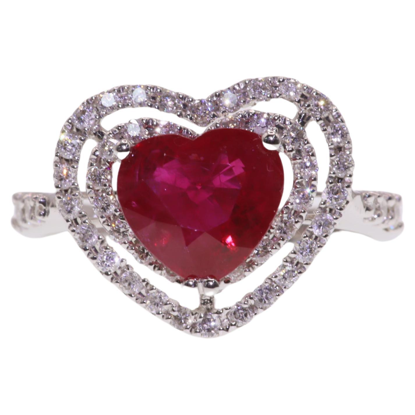 Indulge in the captivating beauty of this IGI Certified 1.48 Carat Heart-Shaped Ruby Ring. This exquisite piece features a stunning heart-shaped ruby, certified by IGI, in a vivid pinkish red color that is guaranteed to leave a lasting