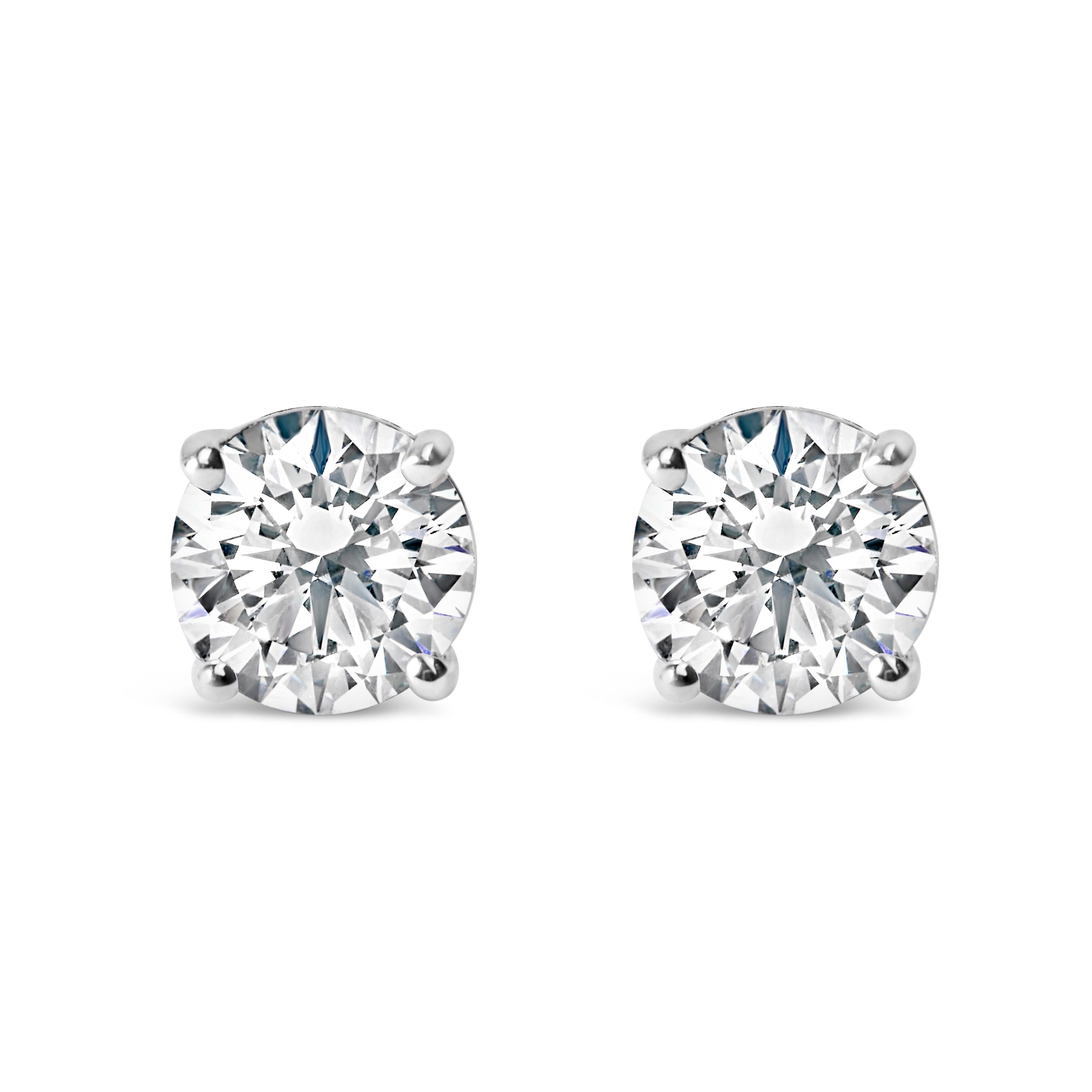 For the poised woman who values everlasting allure, these solitaire diamond studs stand as the pinnacle of sophistication. Magnificently encased in 14k white gold, each stud is graced with a real brilliant-cut diamond, collectively summing up to 1