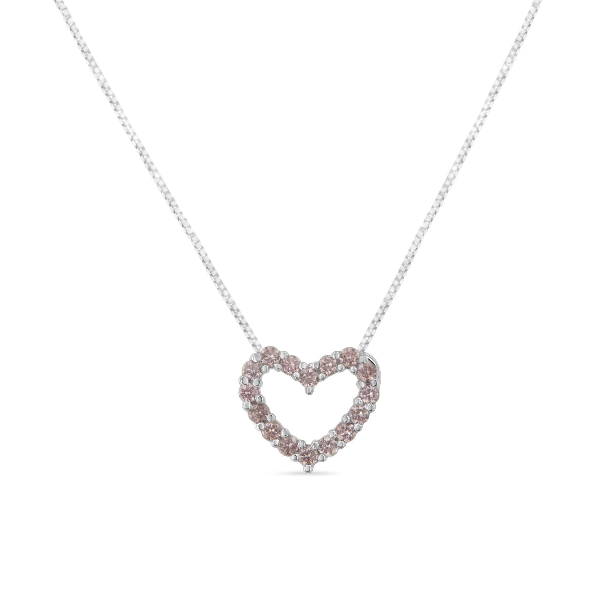 A pink diamond is always a gorgeous choice, and this pink diamond studded heart takes center stage. This  heart-shaped necklace is composed of 16 real, natural light pink diamonds. Each round diamond is set within prongs in 14 karat white gold to