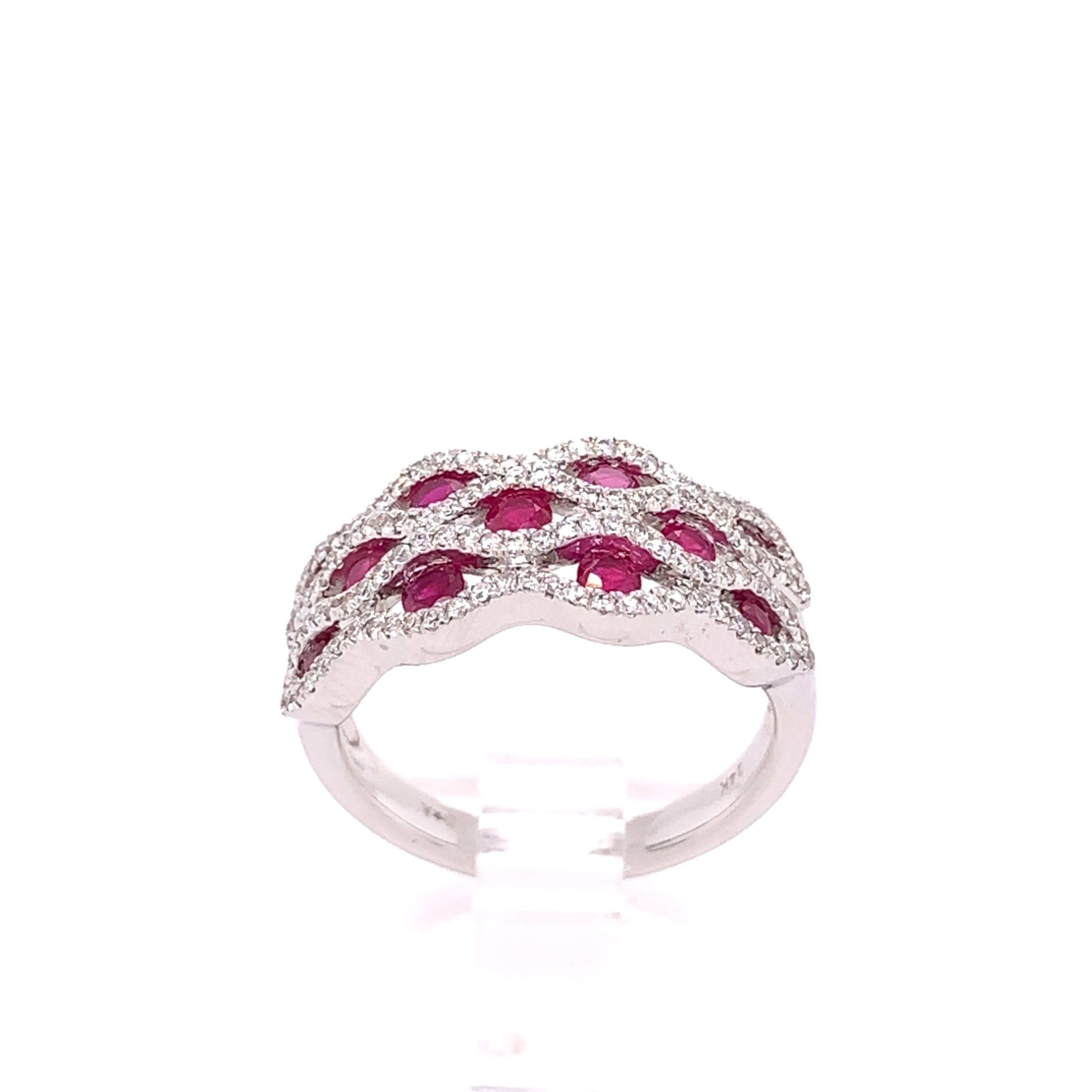 A stunning cocktail ring crafted in luxurious 14 karat white gold with 11 round natural ruby stones weighing approximately 0.66 carats. 

This ring also contains 118 natural round brilliant diamonds weighing approximately 0.35 carats, H-I color, and
