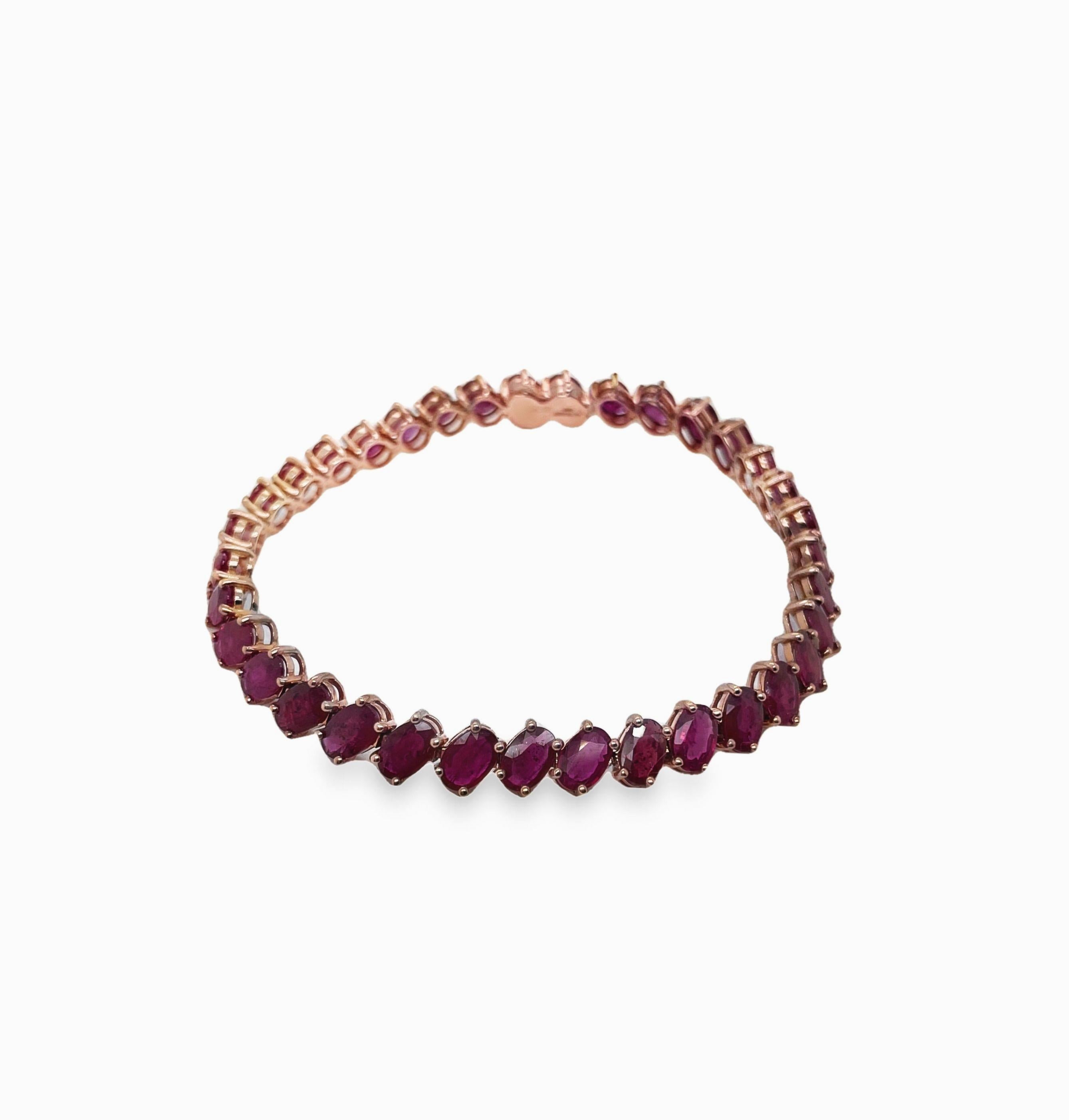Adorn your wrist with a touch of exquisite allure – a rose gold bracelet featuring 16.74 carats of natural oval-cut rubies. Set in 14K pink gold, this captivating piece effortlessly combines the timeless beauty of rubies with a chic and contemporary