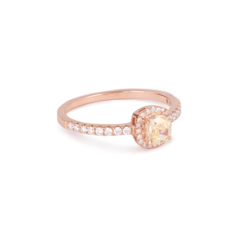 Crafted in 1.98 grams of 18-karat Rose Gold, The Osend Ring contains 36 Stones of Round Diamonds with a total of 0.22-Carats in F-G Color and VVS-VS Clarity combined 1 Stone of Cushion Diamond with a total of 0.47-Carats in Fancy Light Yellow Color