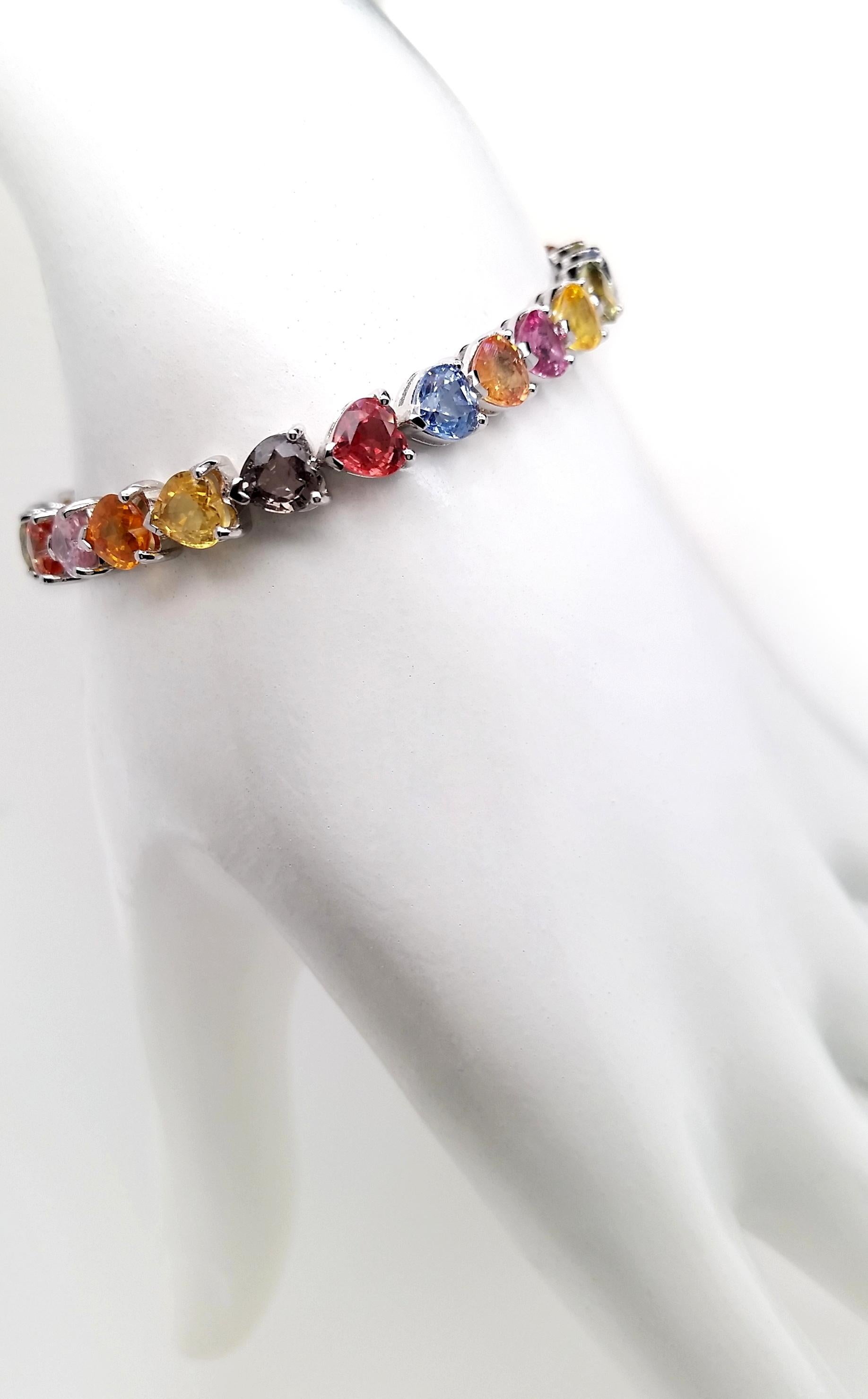 These splendid multi-color heart-shaped sapphires are set in 14K white gold bracelet, by Top Crown Jewelry House collection, to create the ultimate statement piece that everyone will remember.

This bracelet is certified by IGI laboratory, report