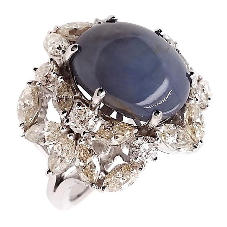Our Top Crown Jewelry House is proud to present this extraordinary new masterpiece. Discover pure elegance with our untreated Burma star sapphire ring—a mesmerizing greyish-blue gem exhibiting a stunning asterism effect that captures celestial