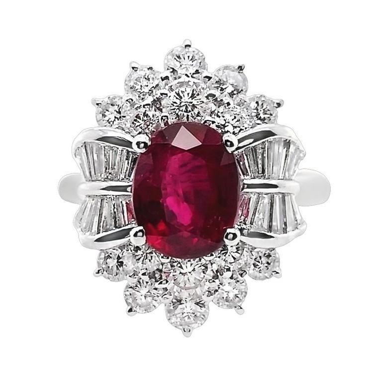 Presenting an enchanting 18K white gold ring featuring a captivating 1.98-carat oval-cut ruby complemented by natural white round brilliant-cut diamonds, this piece effortlessly embodies style and glamour. Crafted as part of our Top Crown Jewelry