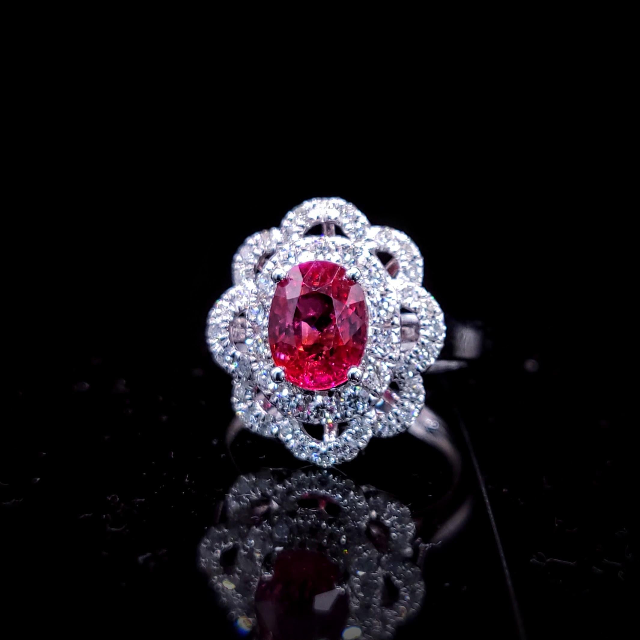 Prepare to be captivated by the breathtaking IGI certified 18K white gold 2.00ct no heat pink sapphire and 0.60ct diamond ring, a masterpiece of fine jewelry design that showcases the exceptional beauty of a rare and intense reddish-pink