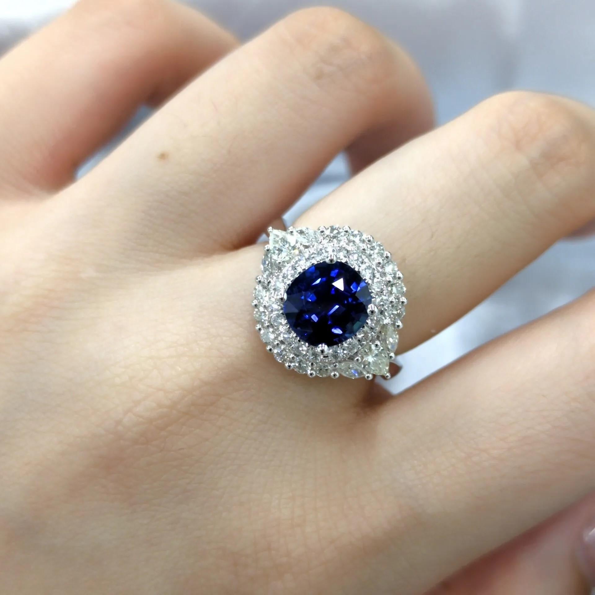 Description

This exquisite ring features a captivating 2.05-carat blue sapphire as its centerpiece. The sapphire is set in a classic four-prong setting, allowing its vibrant blue color and brilliance to shine.

Surrounding the sapphire is a