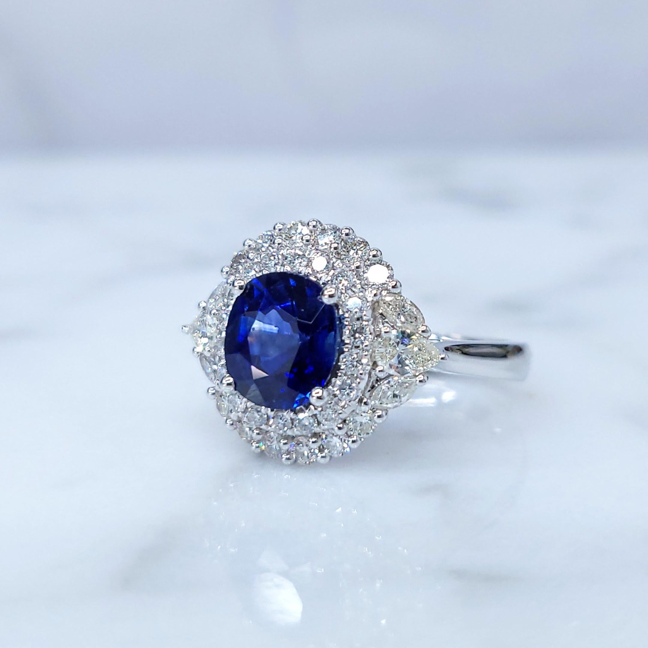 Modern IGI Certified 2.05 Carat Blue Sapphire & Diamond Ring in 18K White Gold For Sale