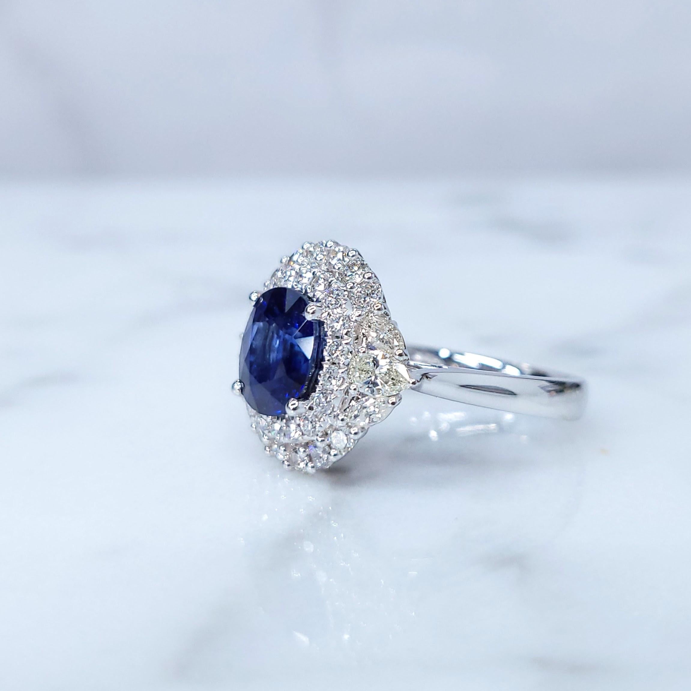 Oval Cut IGI Certified 2.05 Carat Blue Sapphire & Diamond Ring in 18K White Gold For Sale