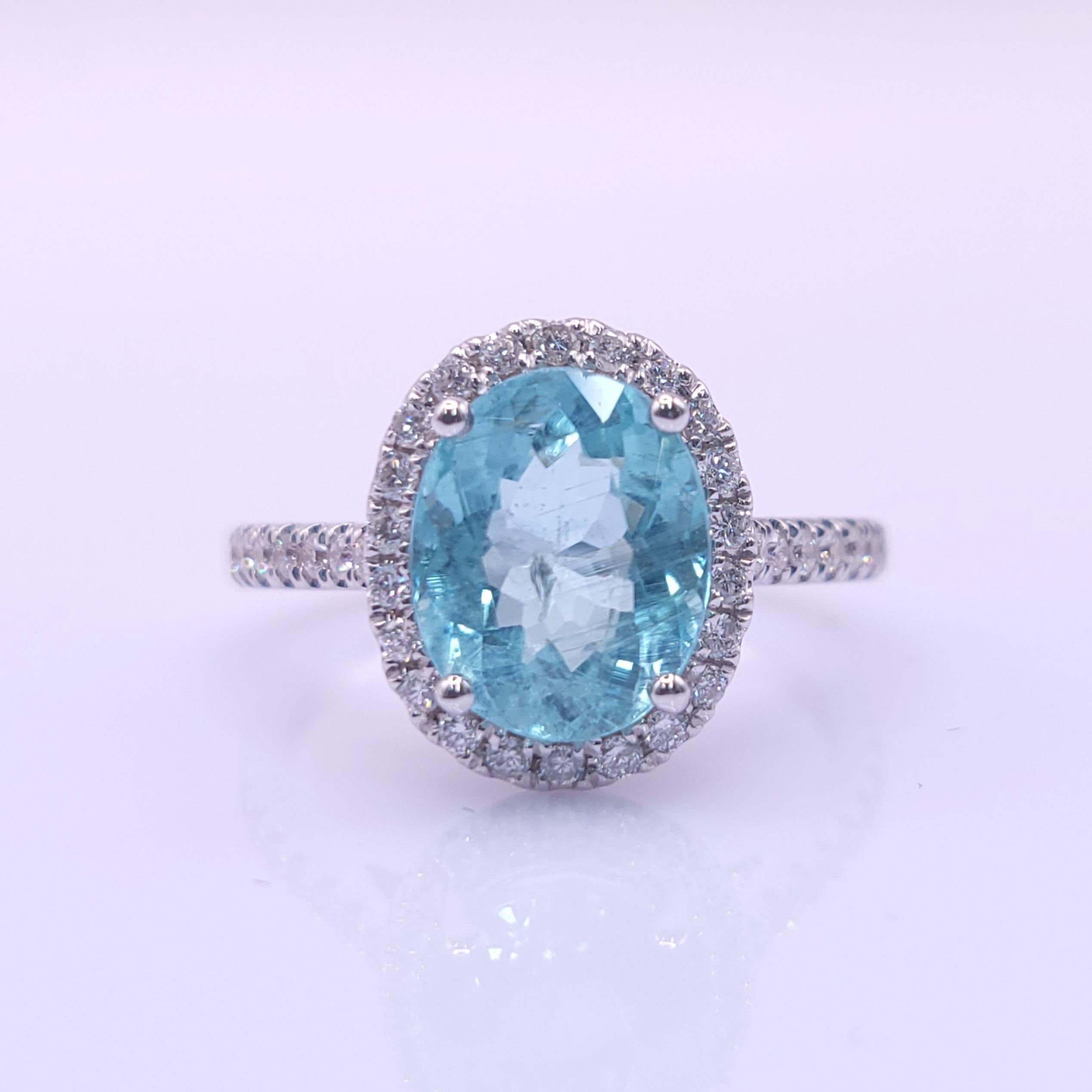 Presenting an exceptional work of art, the IGI Certified 2.08 Carat Natural Parabia and Diamond Ring boasts timeless elegance and captivating beauty. This extraordinary ring showcases a mesmerizing  2.08 carat natural Parabia gemstone with a