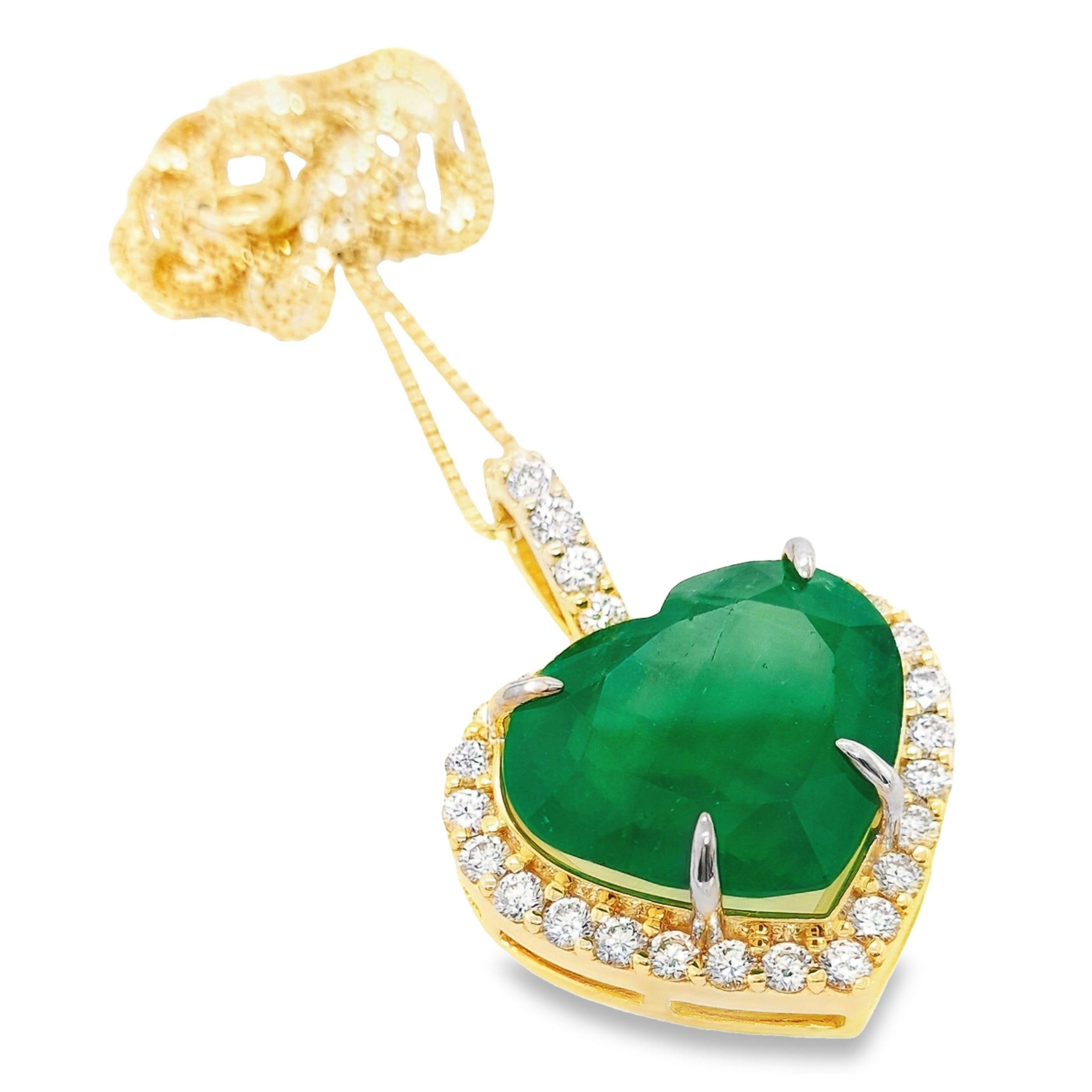 Drape yourself in lavish decadence with our 18K yellow gold necklace, featuring a striking pendant. The focal point is a breath-taking 21.20-carats natural Colombian emerald, adorned by 1.60-carats of naturally brilliant diamonds. This exclusive