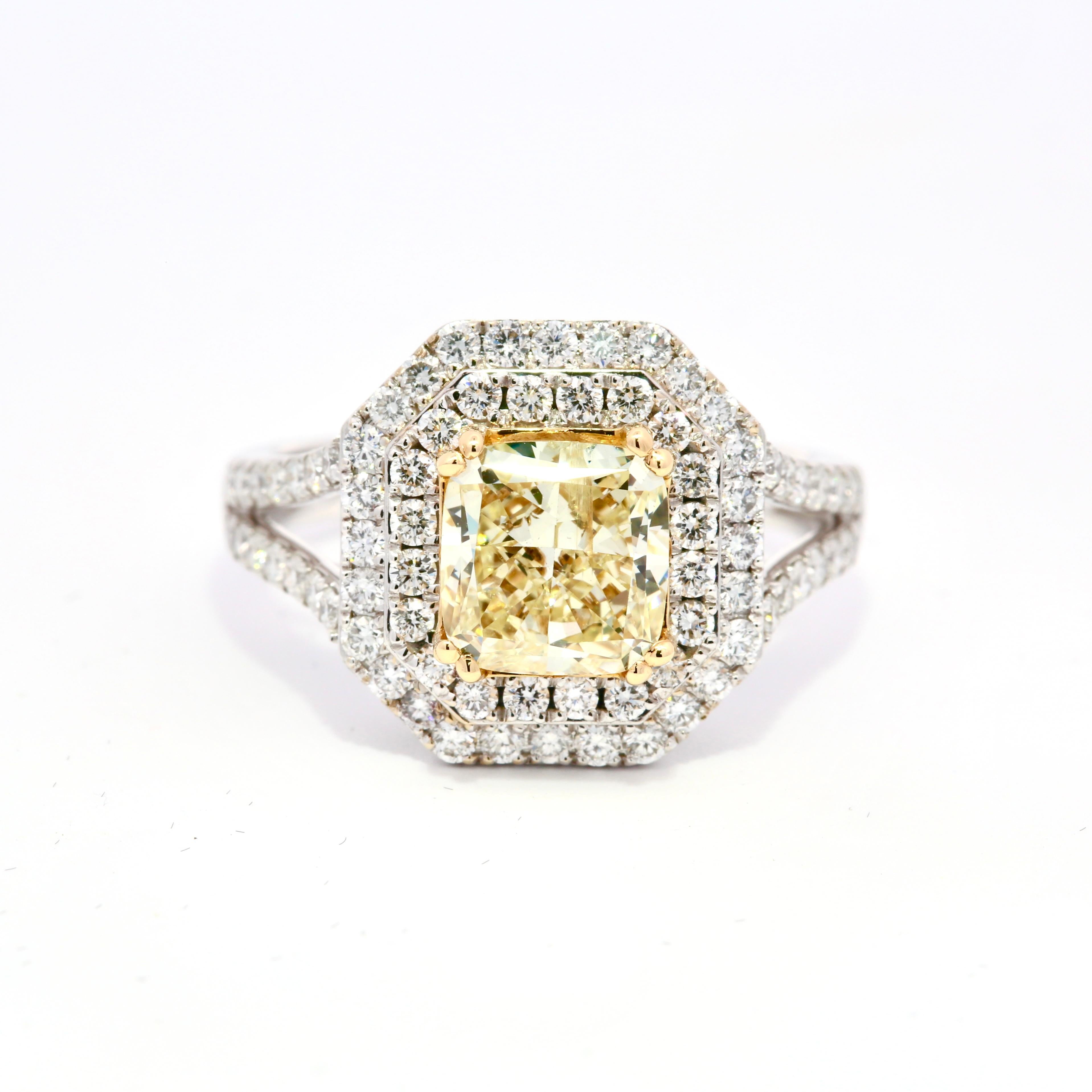 Introducing the epitome of luxury and elegance: our IGI Certified 2.13 Carats Fancy Yellow Diamond Ring. This exquisite piece of jewelry is a celebration of rare beauty and unparalleled craftsmanship, designed to captivate hearts and turn heads.