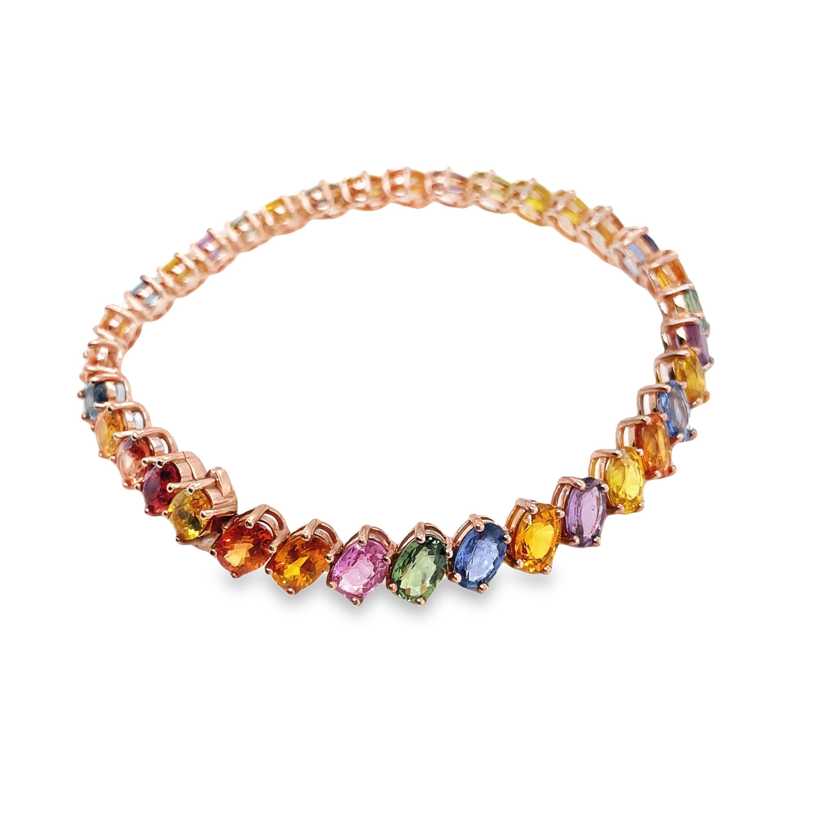 Explore the timeless beauty of our 14K pink gold bracelet, adorned with 35 pieces of natural multi-color sapphires totalling 21.35 carats. This exquisite piece, weighing a total of 14.52 grams, beautifully captures the spectrum of colors in each