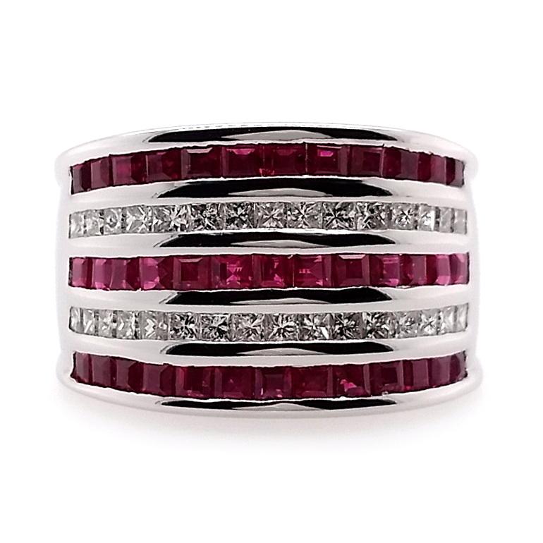 This large white gold ring from Top Crown Jewelry house collection, is an inspired take on the classic eternity ring.
This graceful natural Burma baguette-cut rubies has deep purplish-red color that combines in pleasant harmony with the glistening