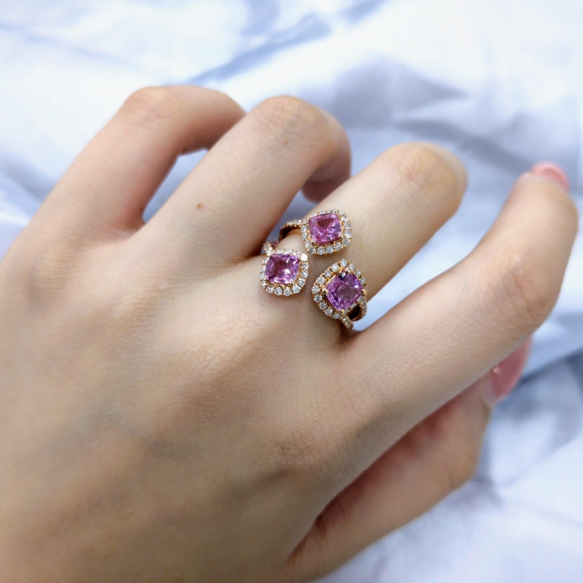 This exquisite ring showcases three stunning pink sapphires, each weighing approximately 0.74 carats. 

This ring features a unique and eye-catching design. A trio of vibrant pink sapphires in matching color, each weighing approximately 0.74 carats,