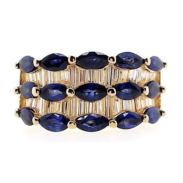 Embrace everlasting allure with this 18K yellow gold ring, featuring marquise-cut sapphires in vivid to deep blue tones. The captivating contrast comes to life with the brilliance of baguette-cut sparkling diamonds, making this dazzling ring a