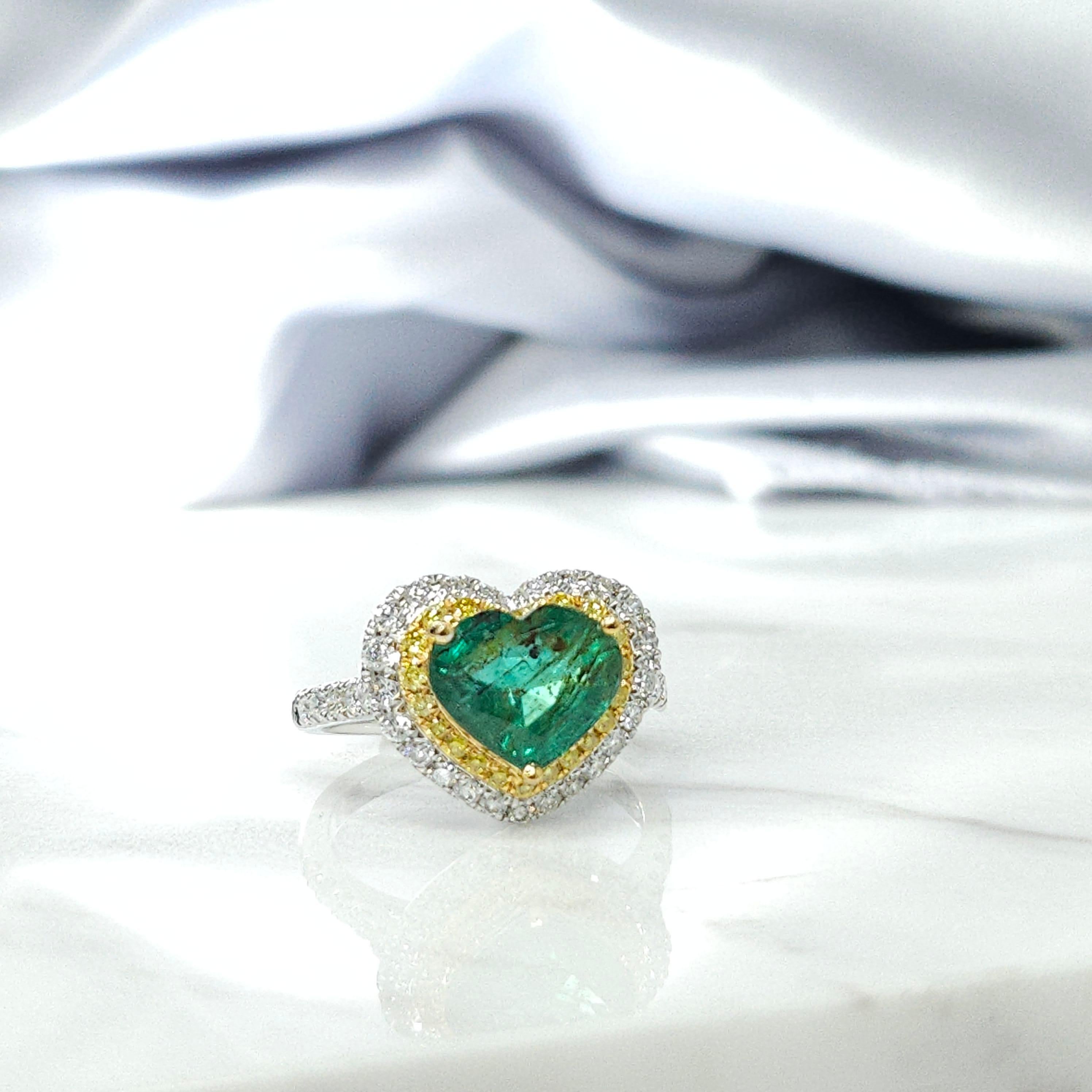 Prepare to be mesmerized by the stunning IGI certified 18K white gold 2.28 Carat Emerald & 0.59ct diamond ring, a true masterpiece of jewelry design. This exquisite piece showcases the captivating beauty of an emerald-cut gemstone in a perfect,