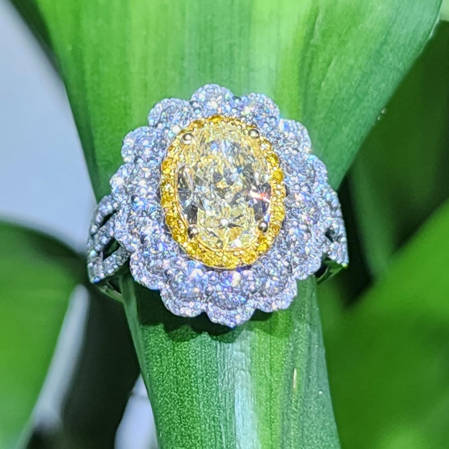 IGI Certified 2.29 Carats N Color Yellow Diamond in 18 Karat Triple Halo Ring For Sale 2