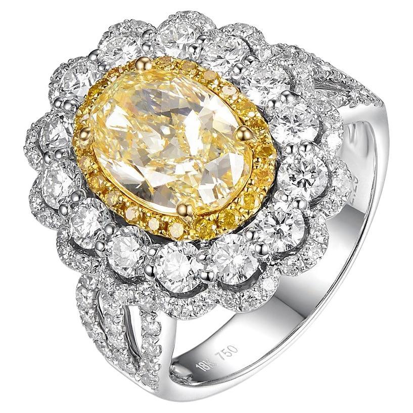 IGI Certified 2.29 Carats N Color Yellow Diamond in 18 Karat Triple Halo Ring For Sale