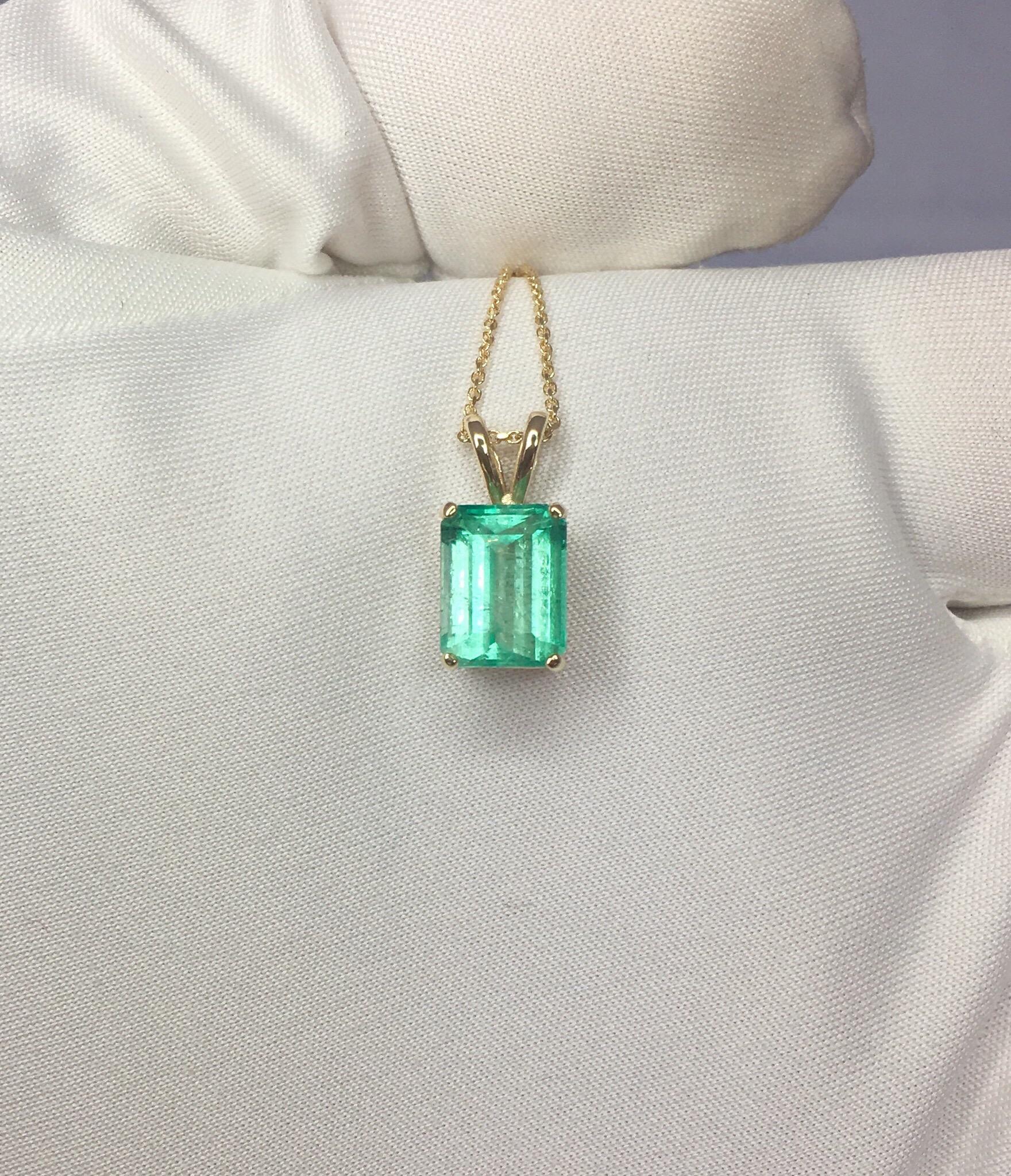 Beautiful bright green emerald set in a fine 14 karat yellow gold solitaire pendant.

2.32 carat emerald fully certified by IGI Antwerp confirming stone as natural and Colombian in origin.

Also has an excellent emerald cut and polish to show lots