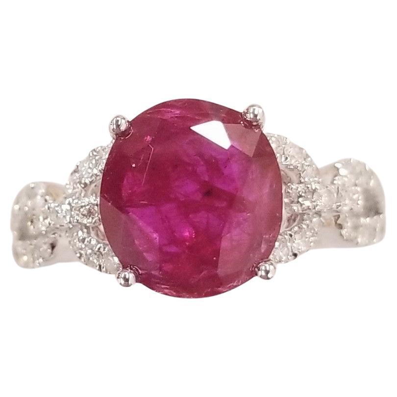 Collectible unheated ruby ring.
The ruby weighs an impressive 2.32 carat and has a beautiful oval shape along with an deep purlish-red color that makes it so special. It is complemented by 0.32 carats of round brilliant-cut diamonds adding sparkle