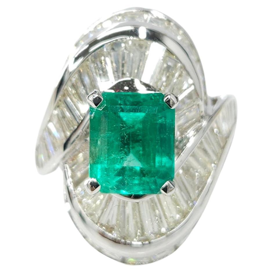 The IGI certified 18K white gold 2.37 Carat Colombian Emerald diamond ring is a stunning piece of jewelry that showcases the beauty of an Emerald shape gemstone. The vivid bluish green color of the Colombian Emerald adds a touch of elegance and