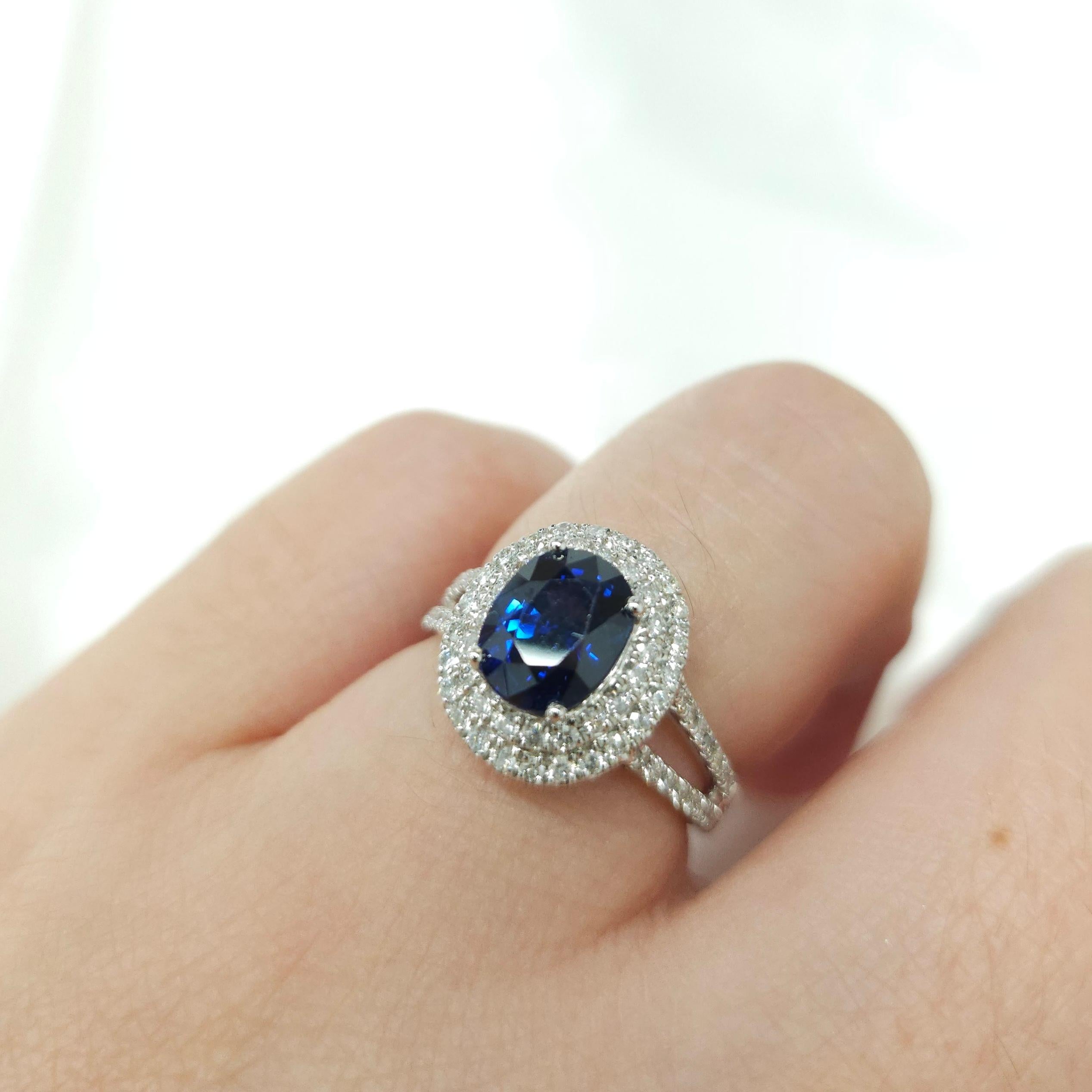Introducing a truly exceptional piece of jewelry, the IGI certified 18K white gold 2.38ct blue sapphire from Sri Lanka and 0.50ct natural white round brilliant cut diamond ring. This exquisite ring showcases the rare beauty of an unheated blue