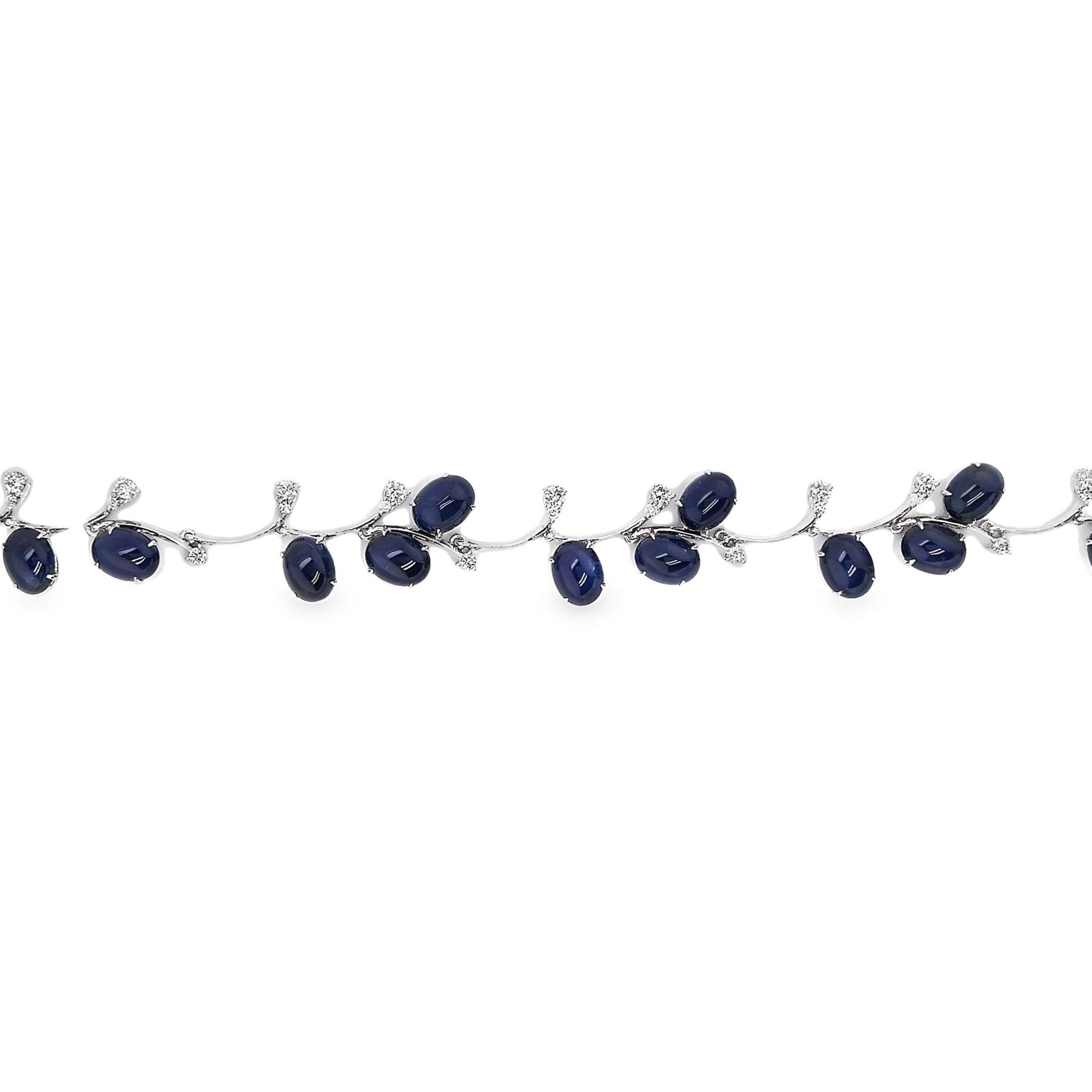 Exquisite 18K White Gold Bracelet set with 24.23ct Natural Sapphires in oval cabochon cuts, radiating an Intense Blue hue with stunning transparency. Accented by 1.01ct Natural Round Brilliant Diamonds, this 17cm bracelet, weighing 19.44g, exudes