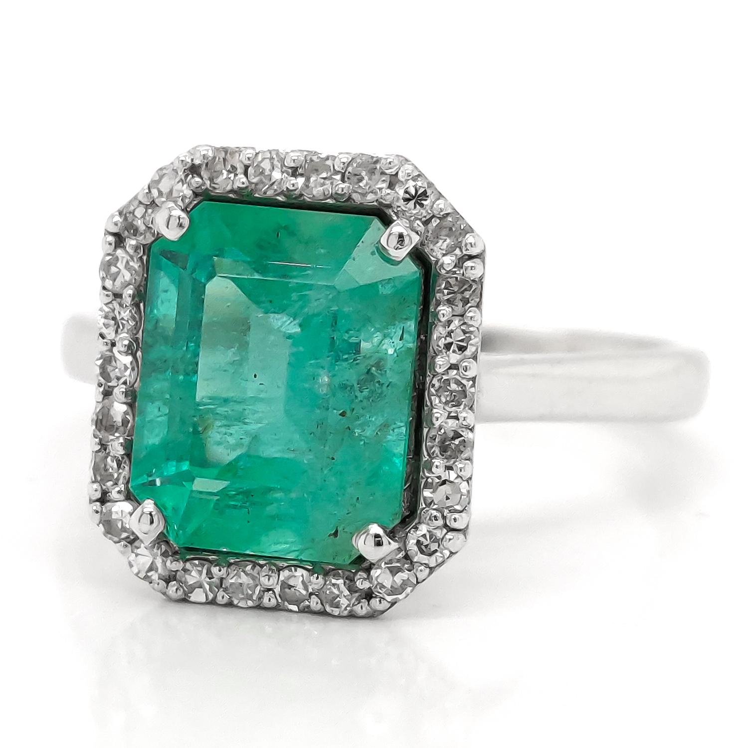 This Gorgeous emerald ring illuminates pure class and elegance with its mesmerizing 2.49ct green emerald, surrounded with breathtakingly sparkly 26-round brilliant diamonds all set in 18kt white gold. This amazing piece of jewelry will immediately