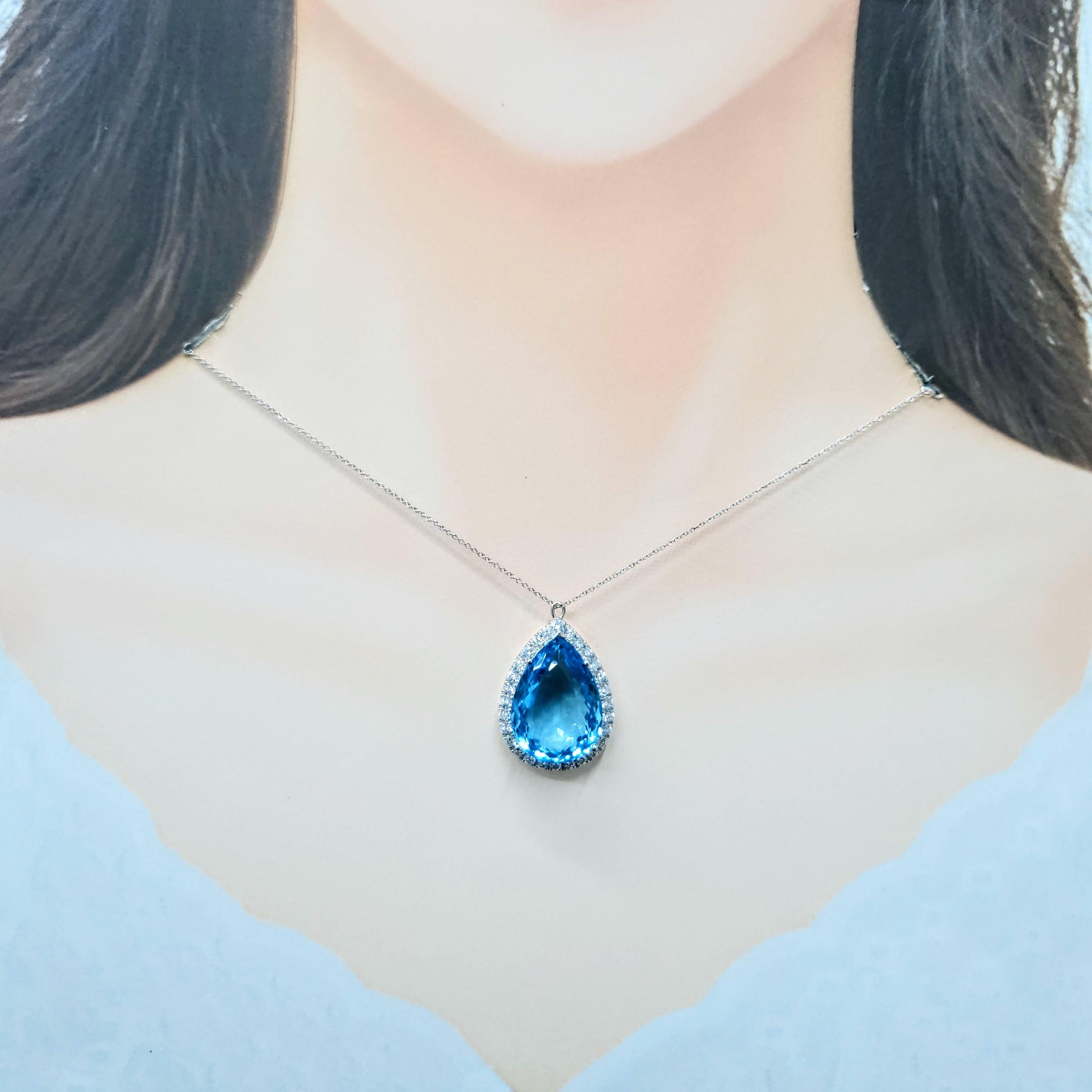 Whitingur, ce pendentif en or blanc 18 carats est un véritable témoignage d'un design luxueux. En son cœur se trouve une magnifique topaze en forme de poire de 25,81 carats, d'un bleu intense qui rivalise avec l'azur le plus profond de l'océan.