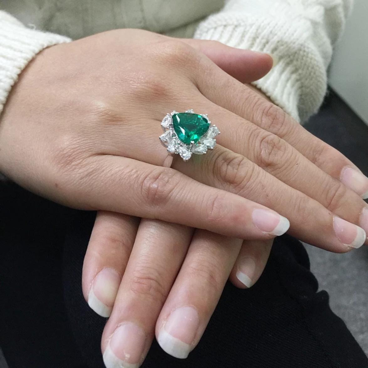 An exquisite heart shape emerald with diamond ring.
These beautiful piece is handmade in Italy in solid 18 carats white gold mounting and is composed of a heart shape emerald and pear cut diamonds halo all very clear and full of brilliance.

The