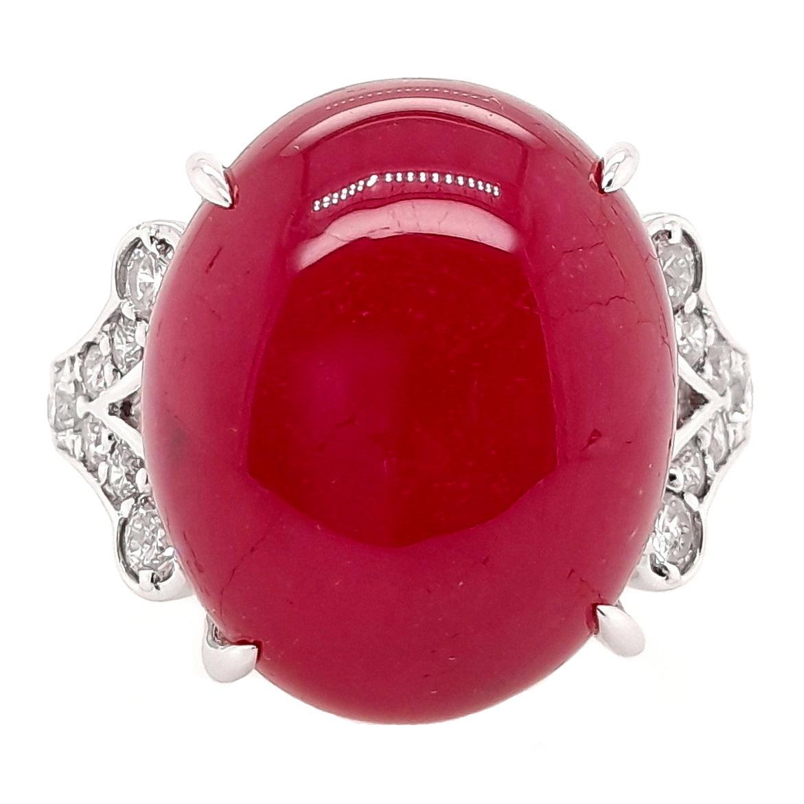 Adorn yourself with pure extravagance in this breath-taking 18K white gold ring, featuring a magnificent 28.34-carat deep purplish-red oval ruby complemented by 0.52 carats of brilliant natural diamonds. This stunning masterpiece embodies the
