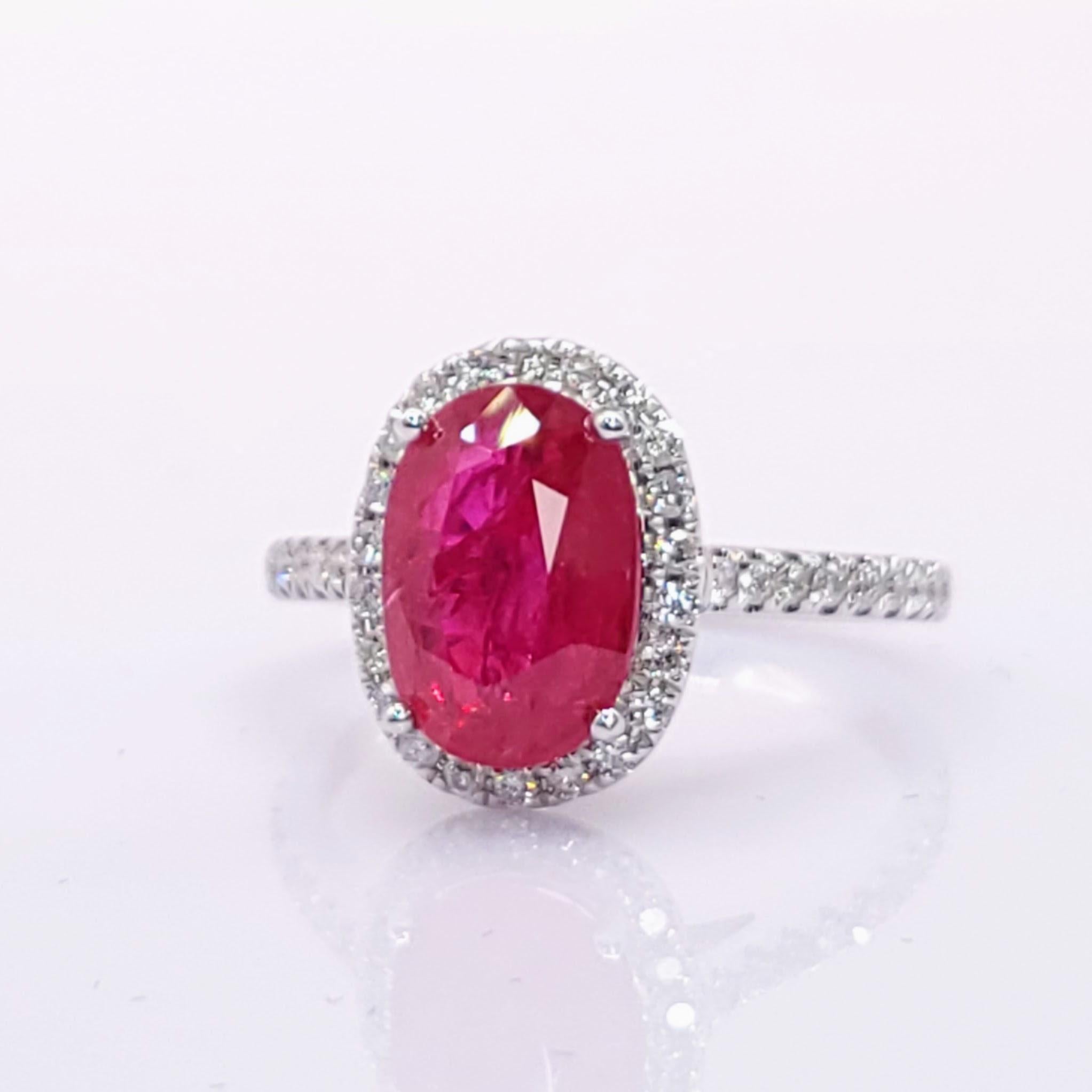 Embrace luxury and sophistication with this exquisite cocktail-style ring, featuring a mesmerizing IGI Certified 2.89 Carat Burma Ruby in a vivid purplish-red hue, elegantly shaped into an oval silhouette that radiates timeless elegance and allure.