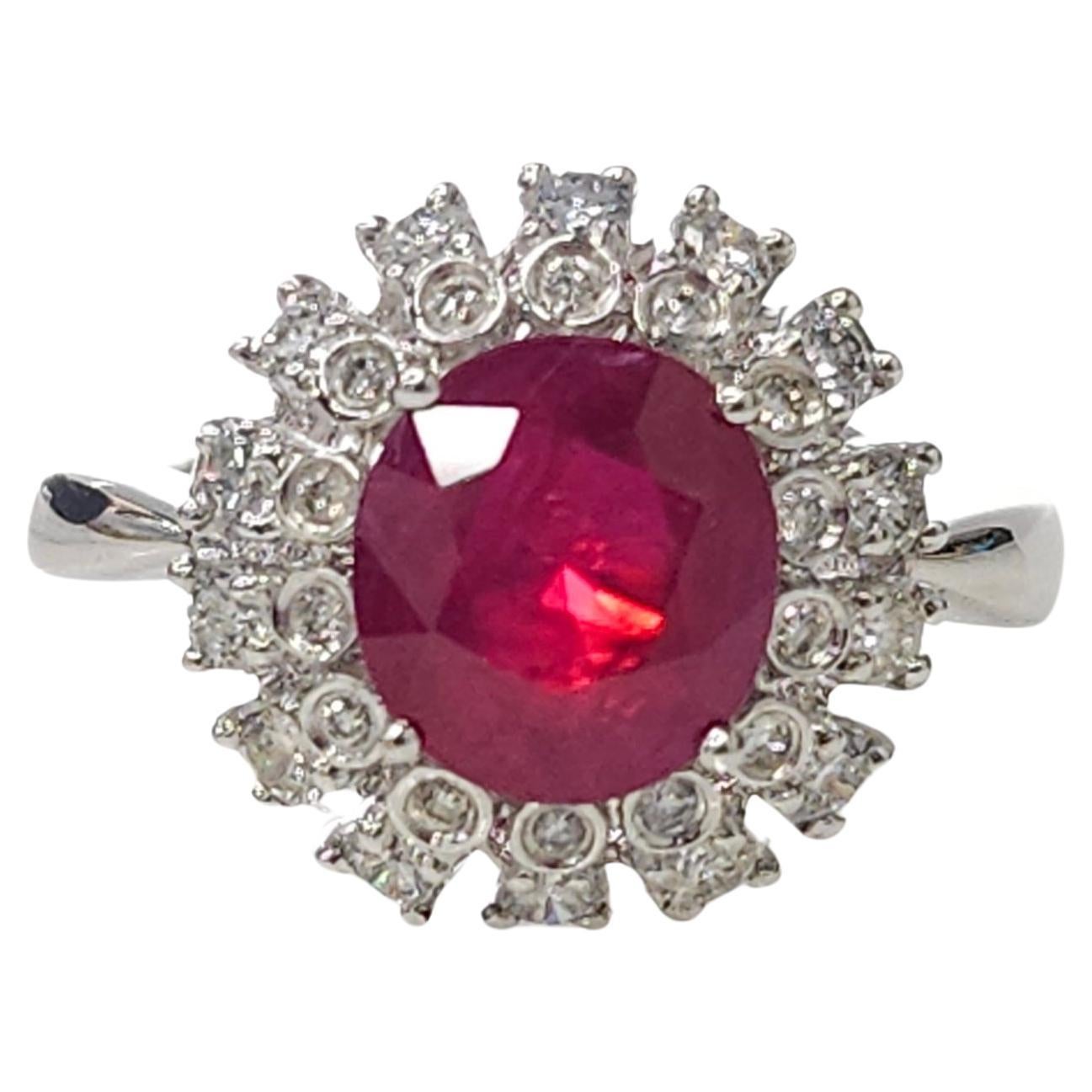 Introducing a magnificent piece of jewelry featuring an IGI Certified 2.91 Carat Ruby, originating from Burma, renowned for its exceptional quality and vivid purplish red color, in a captivating oval shape. This extraordinary gemstone takes center