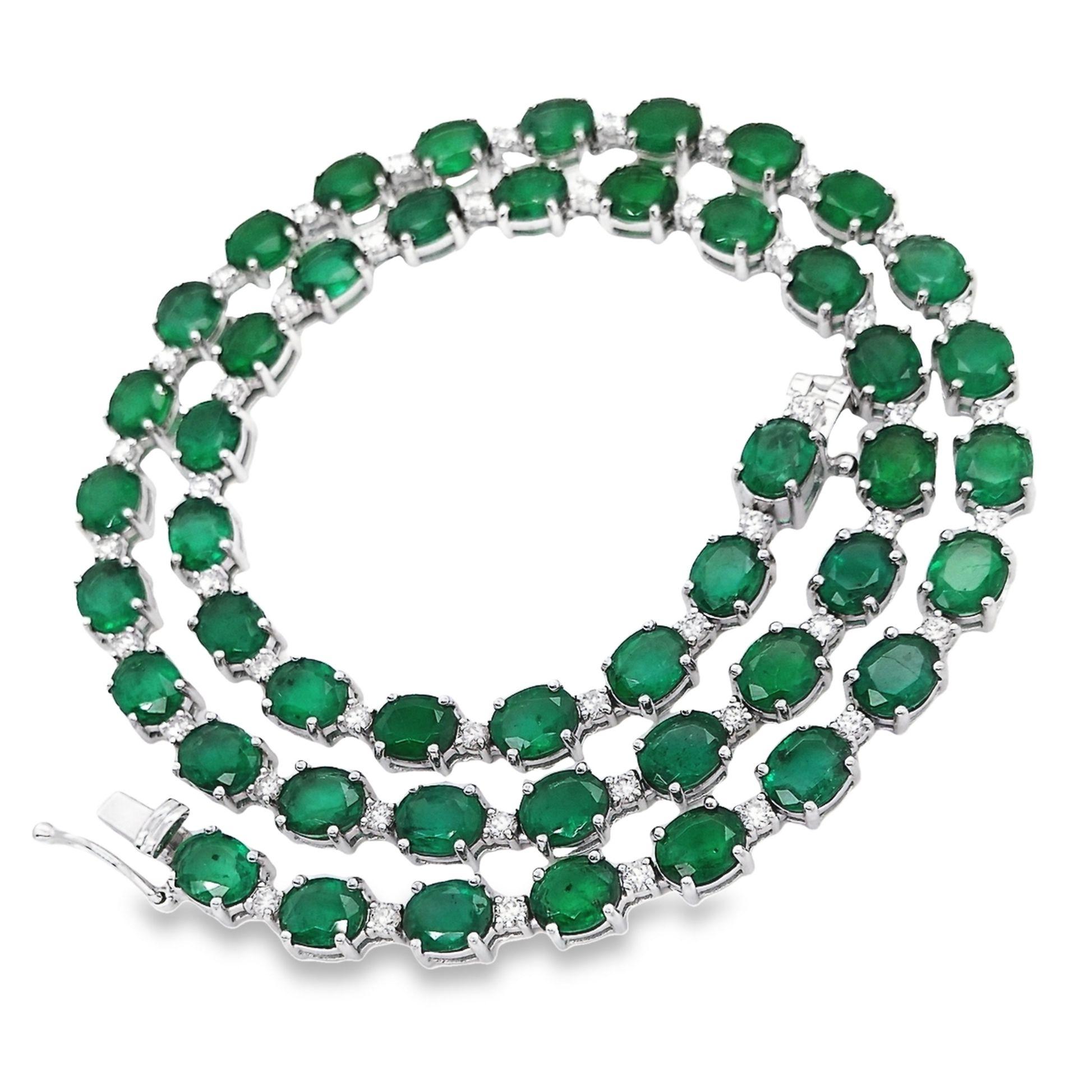 This exquisite necklace, by Top Crown Jewelry, measuring 41 cm in length, features IGI Certified 29.42ct of intense-green natural Zambian Emeralds complemented by 1.77ct of sparkling natural Diamonds. Elegantly set in 18K white gold, this luxurious