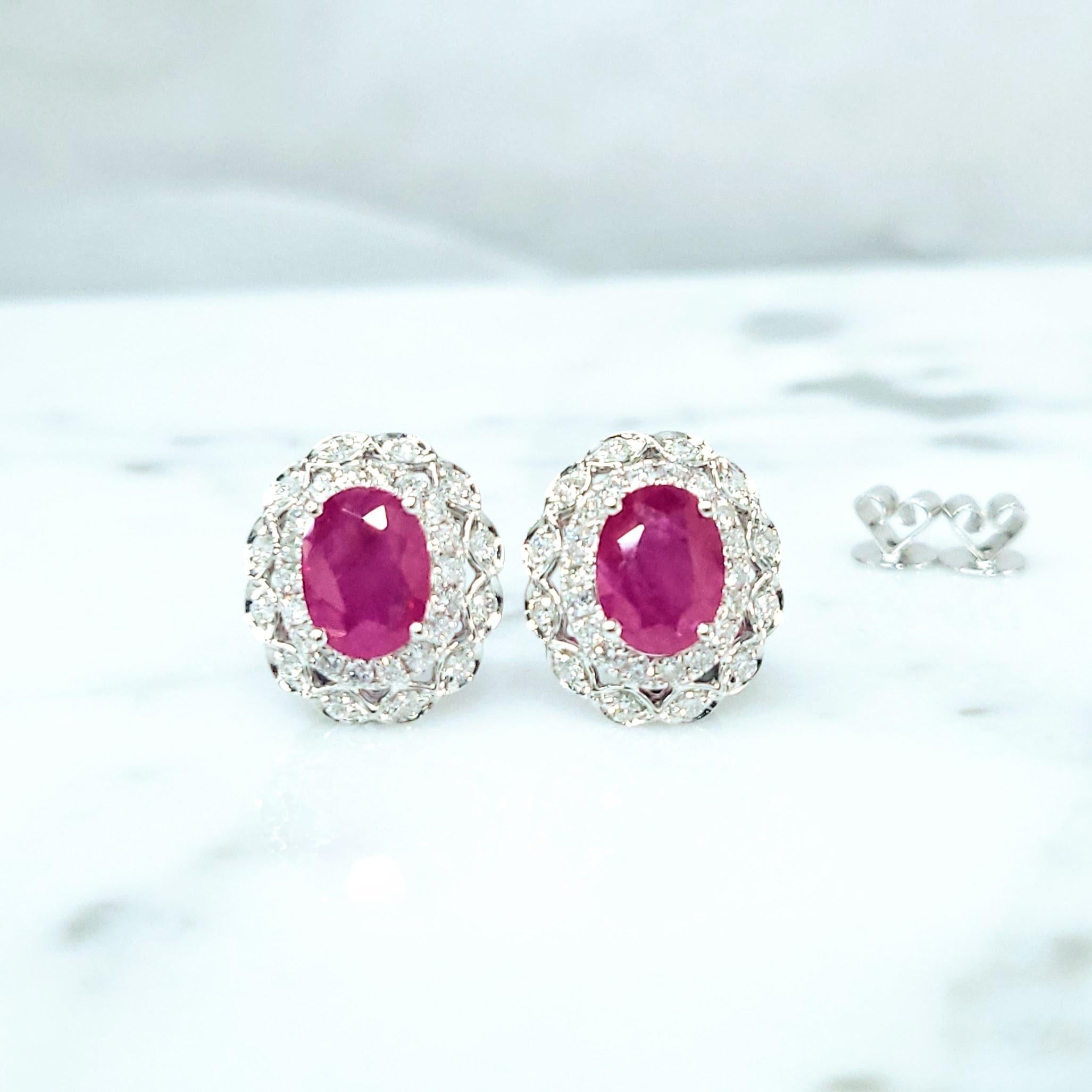 Captivating 18k White Gold Earrings with Intense Pinkish-Red Burmese Rubies and Diamond Halos

These stunning earrings showcase the mesmerizing beauty of natural Burmese rubies, highly prized for their exceptional color and origin. Each earring