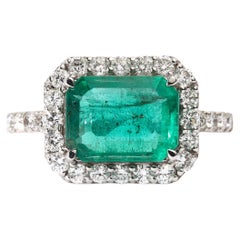 IGI Certified 2ct Natural Emerald & Diamond Halo Engagement Ring - 18K WhiteGold