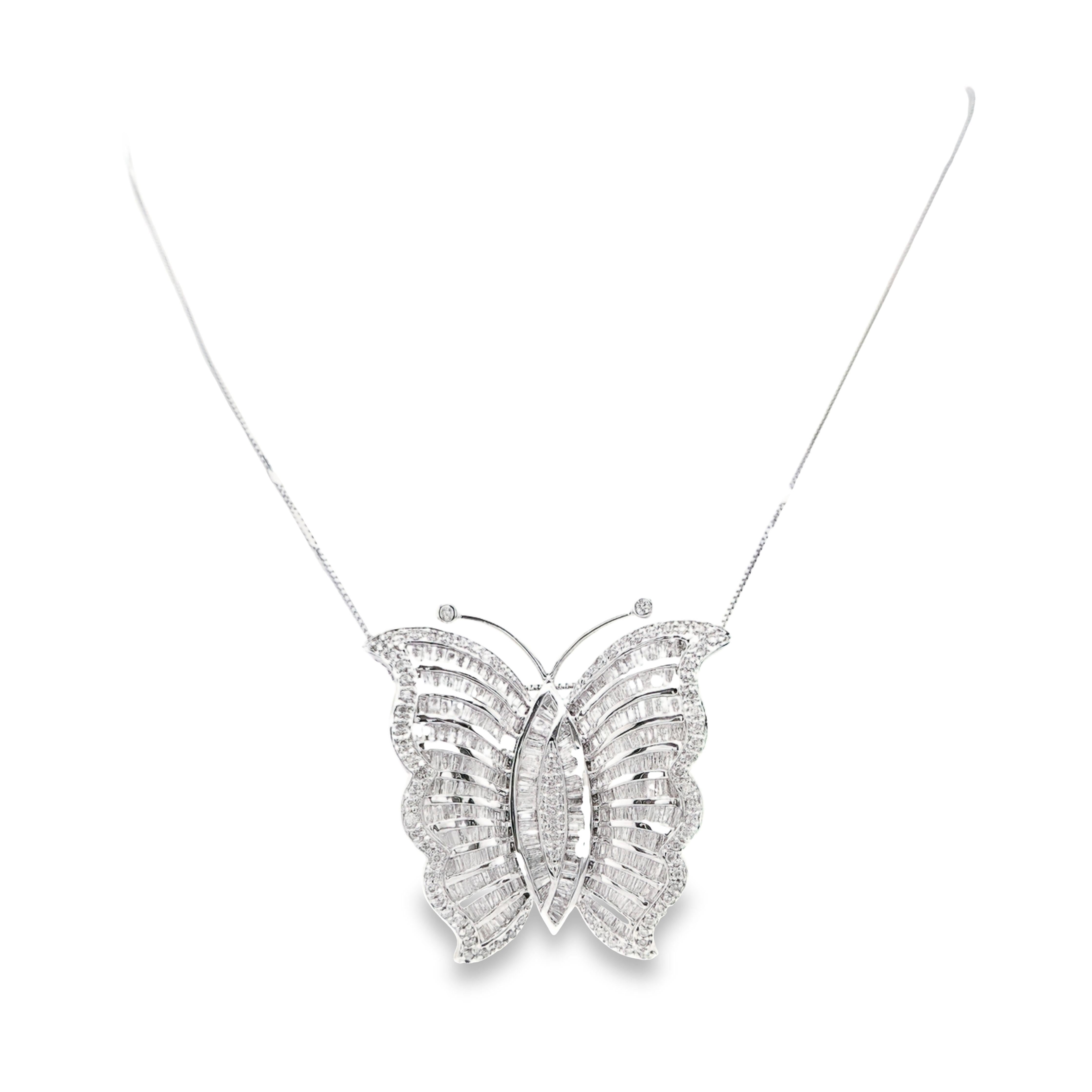 Indulge in the ultimate luxury with this stunning 18K white gold set by Top Crown Jewelry. This versatile piece seamlessly transforms from a pendant necklace to a brooch, offering endless styling possibilities. Adorned with approximately 600 natural