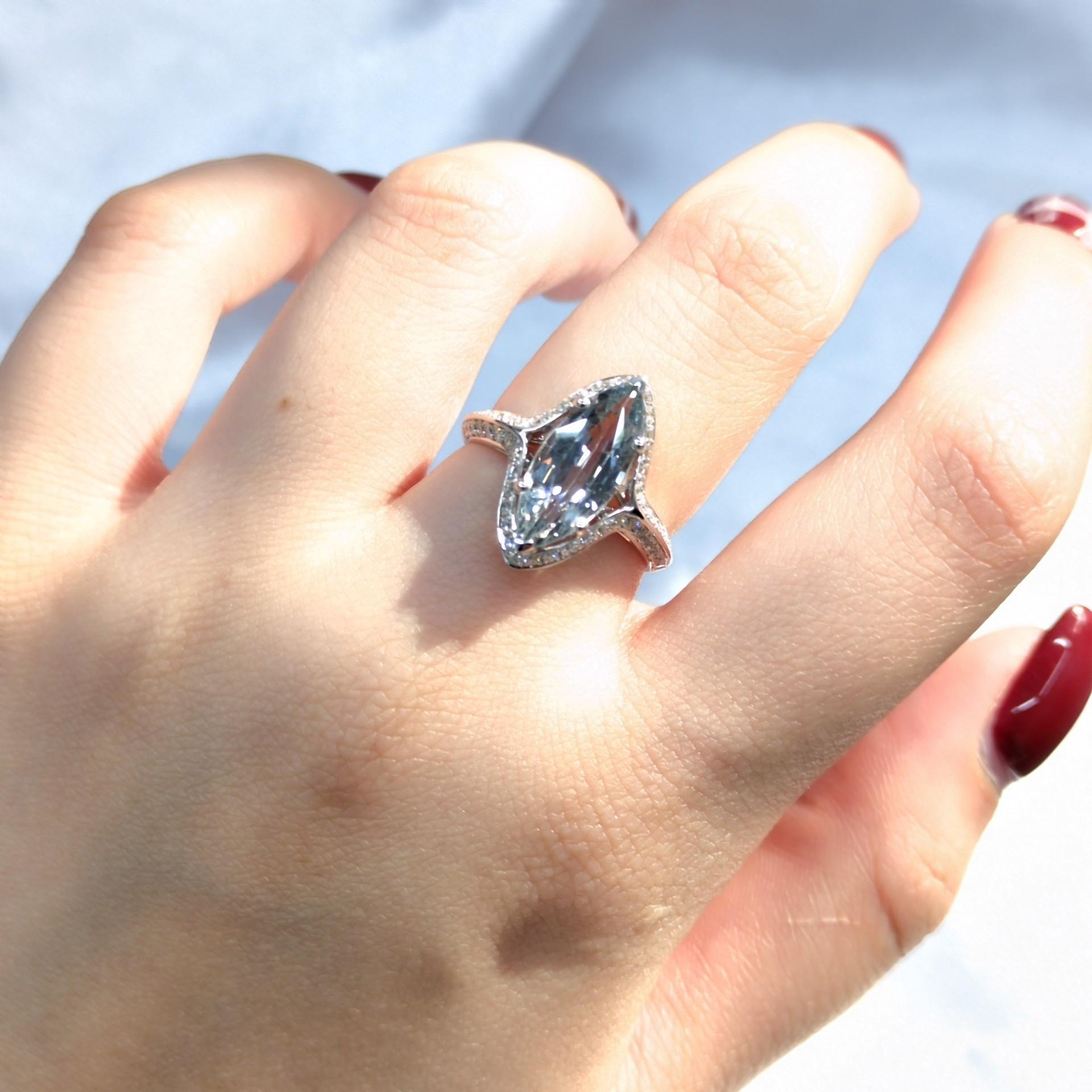 A Timeless Treasure: A 3.05 Carat Unheated Greyish Green Sapphire Ring
This exquisite ring showcases a stunning 3.05-carat marquise-cut unheated greyish green sapphire, a rare and captivating gemstone. The sapphire is set in a classic six-prong