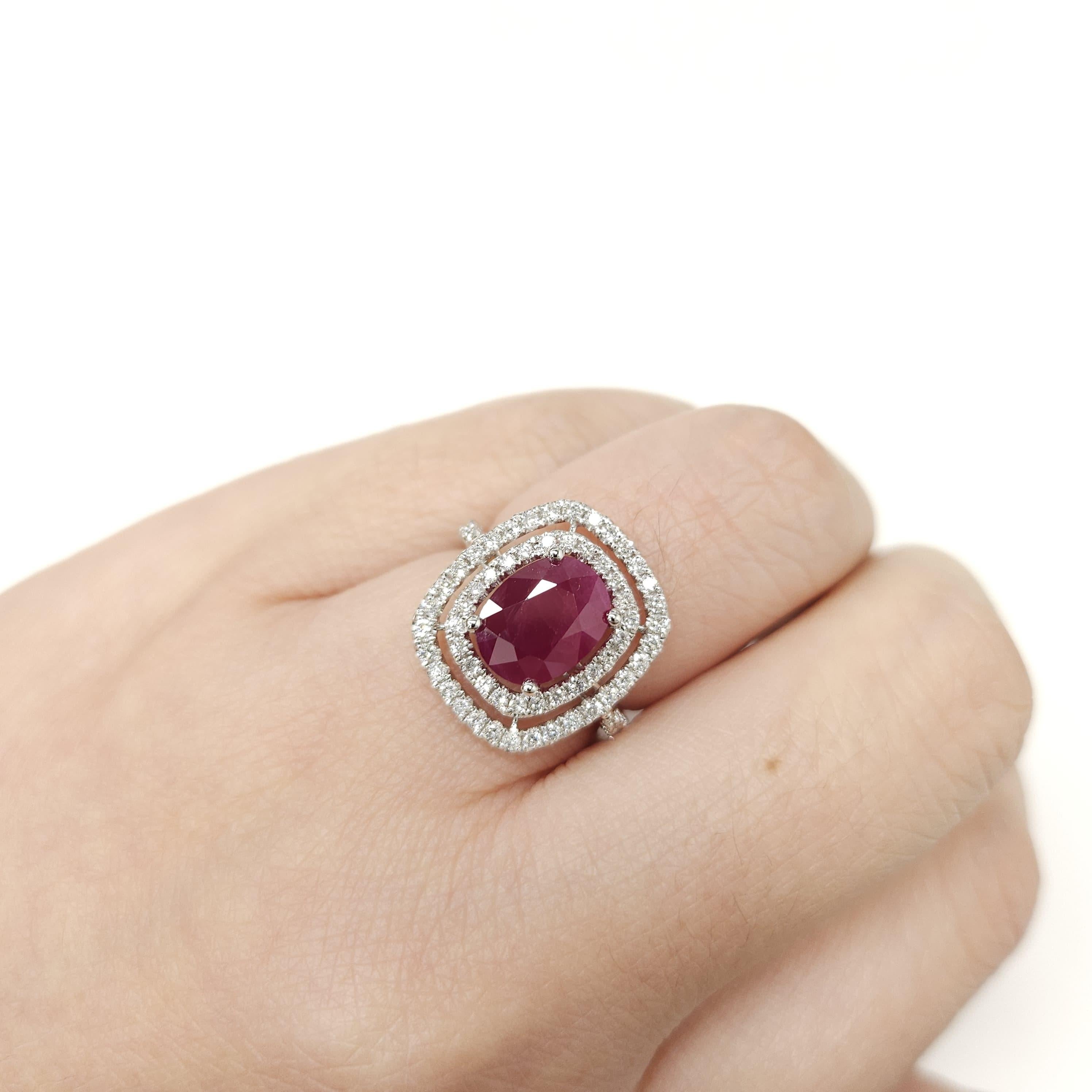 Experience the epitome of glamour and luxury with this exquisite IGI Certified 3.05 Carat Oval-Shaped Ruby Ring. Showcasing a deep purplish red ruby of exceptional quality and a captivating oval shape, this ring is a true masterpiece in fine