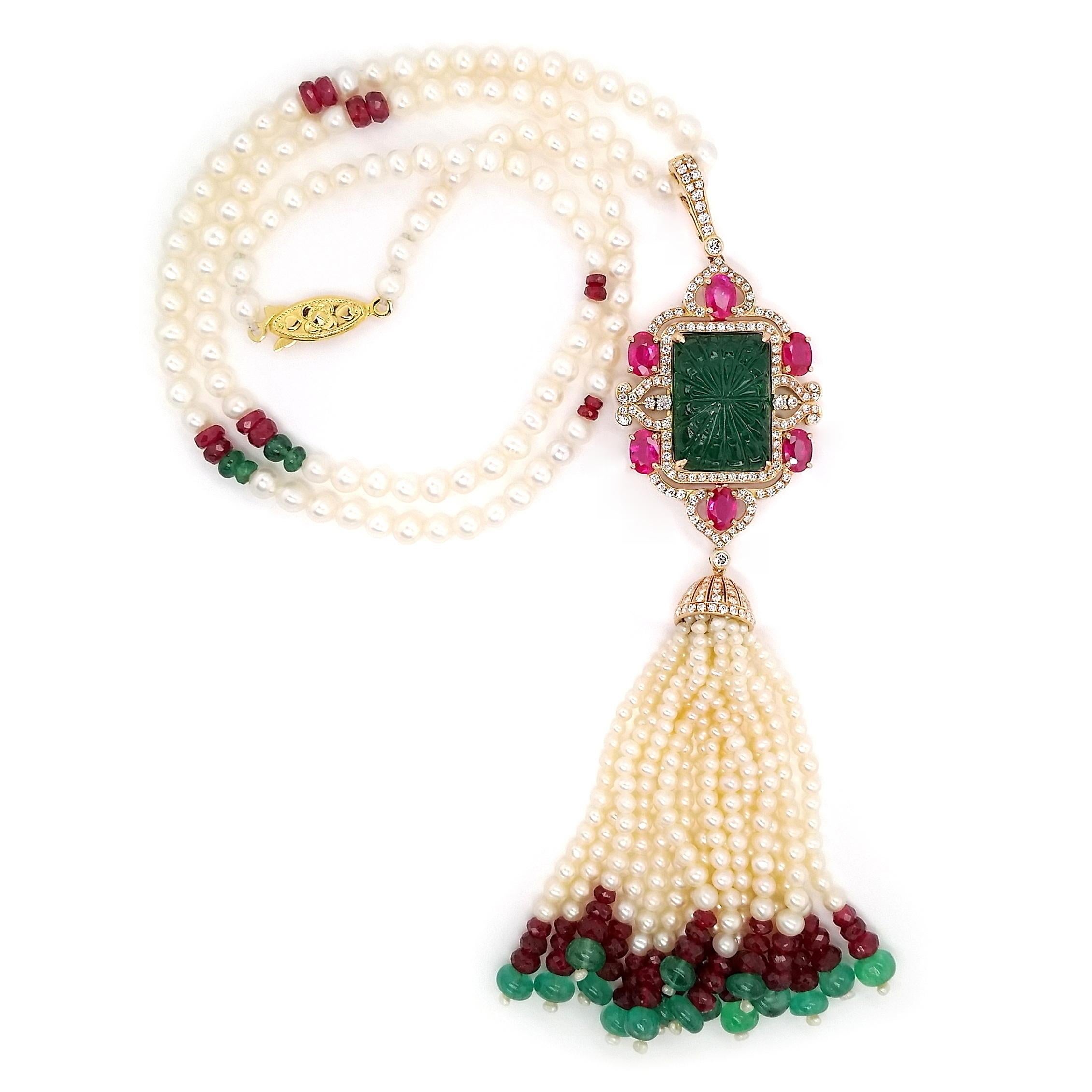 Experience true magnificence with this extraordinary 50cm necklace, set in an 18K pink and yellow gold masterpiece. A 16-carats rectangular intense bluish-green emerald takes center stage, surrounded by oval rubies in vivid pink-red, 414