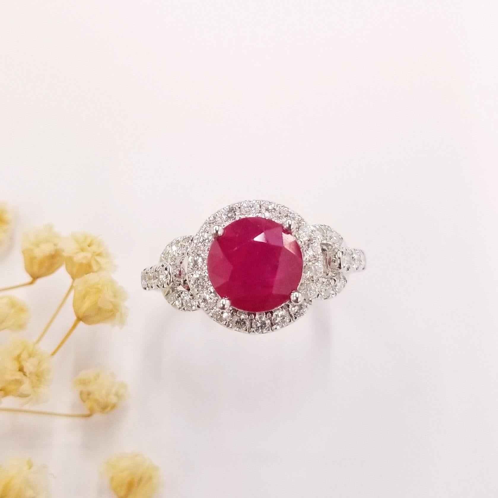 Elevate your style with this enchanting chain-style ring crafted in 18K white gold, featuring a captivating 3.10 carat deep red Burma ruby in a rare and perfect round shape. This exquisite ruby showcases a rich, velvety red hue that exudes passion